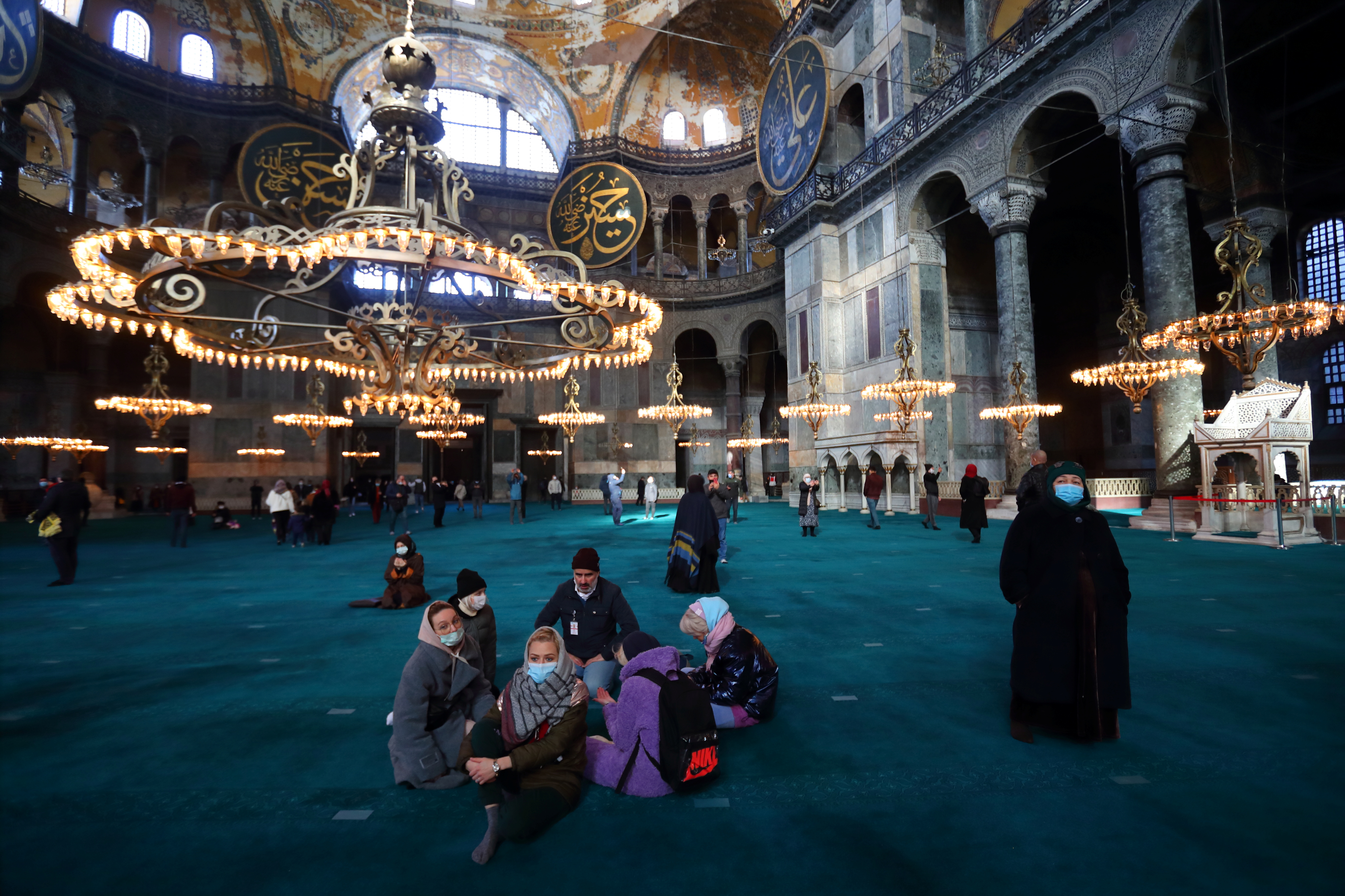 Russian tourists visit Hagia Sophia Grand Mosque in Istanbul