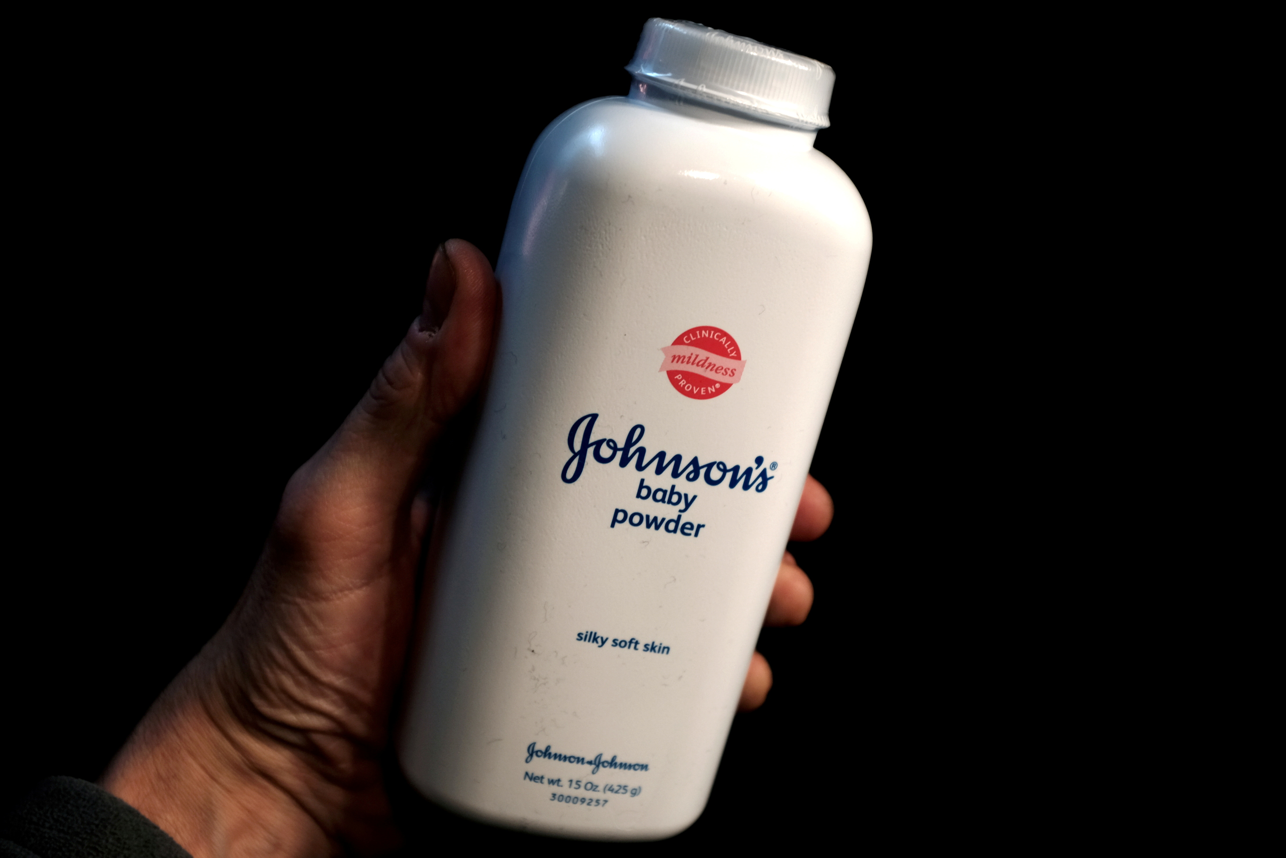 A bottle of Johnson and Johnson Baby Powder is seen in a photo illustration taken in New York, February 24, 2016. REUTERS/Mike Segar/Illustration