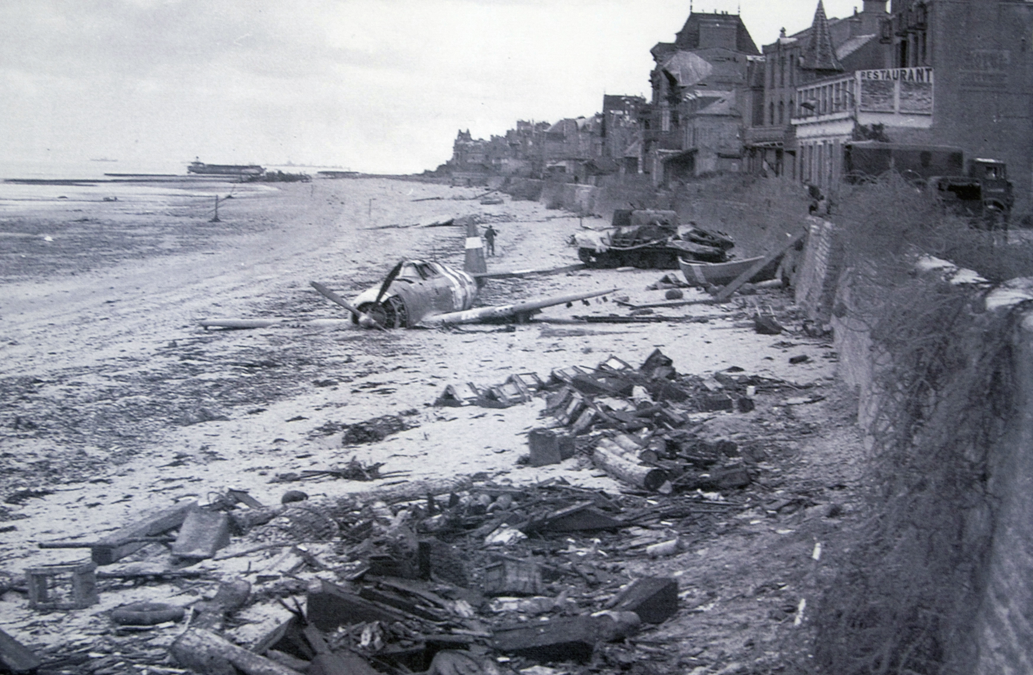 Handout photo of a crashed U.S. fighter plane on the waterfront on a Juno Beach D-Day landing zone in Saint-Aubin-sur-Mer