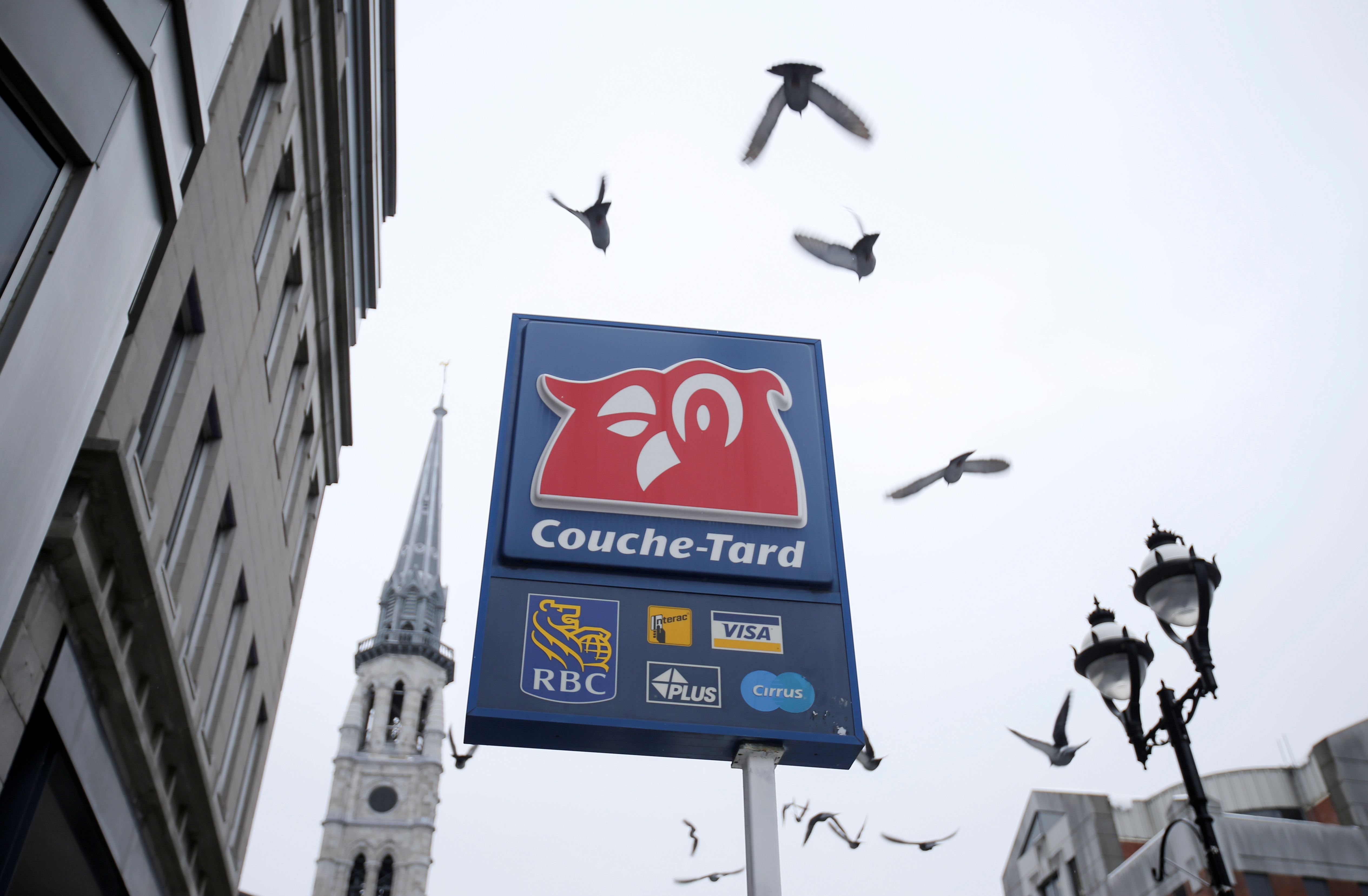 The logo of a Couche-Tard convenience store is seen in Montreal