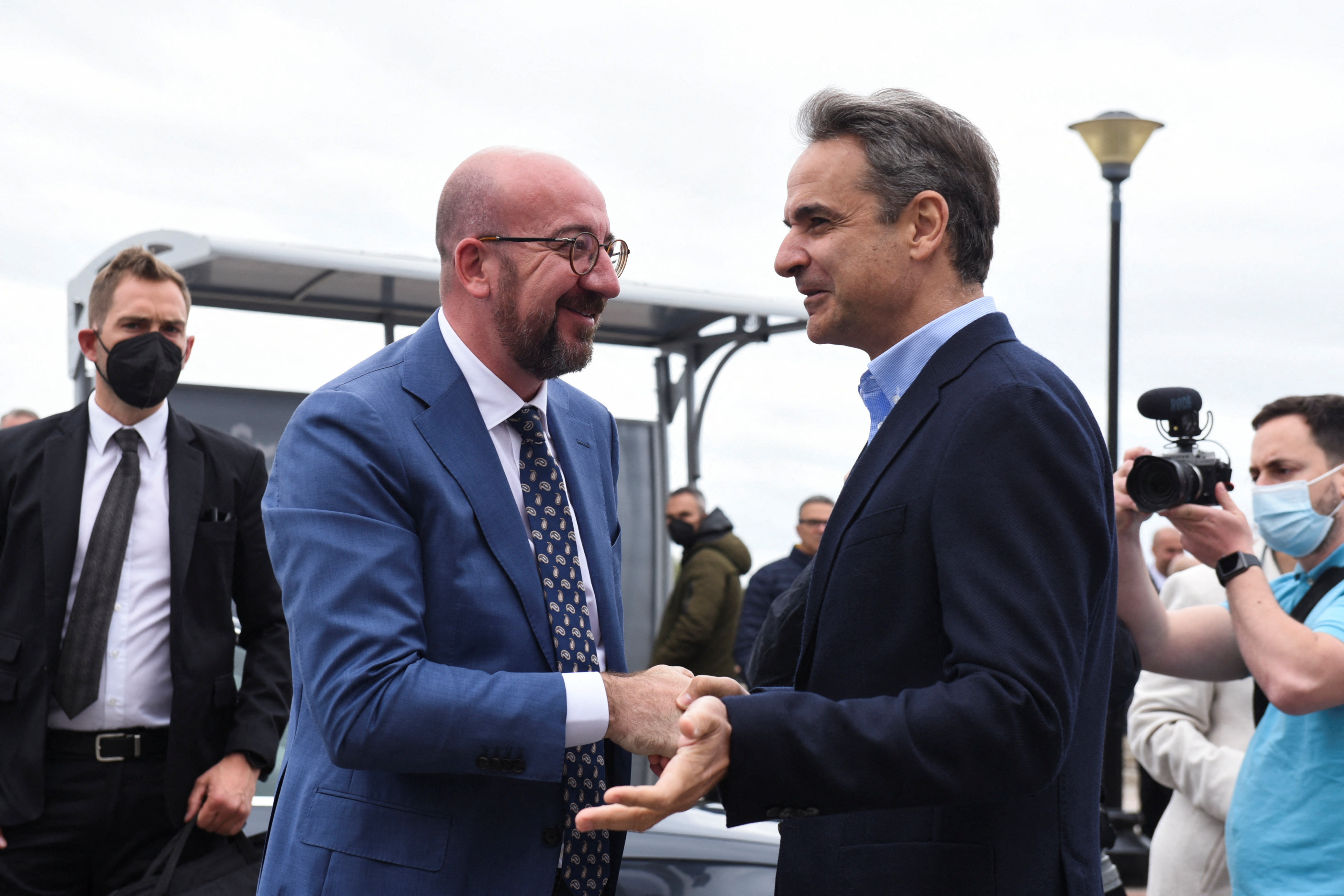 Greek Prime Minister Kyriakos Mitsotakis speaks with the European Council President Charles Michel, during an event in Alexandroupolis