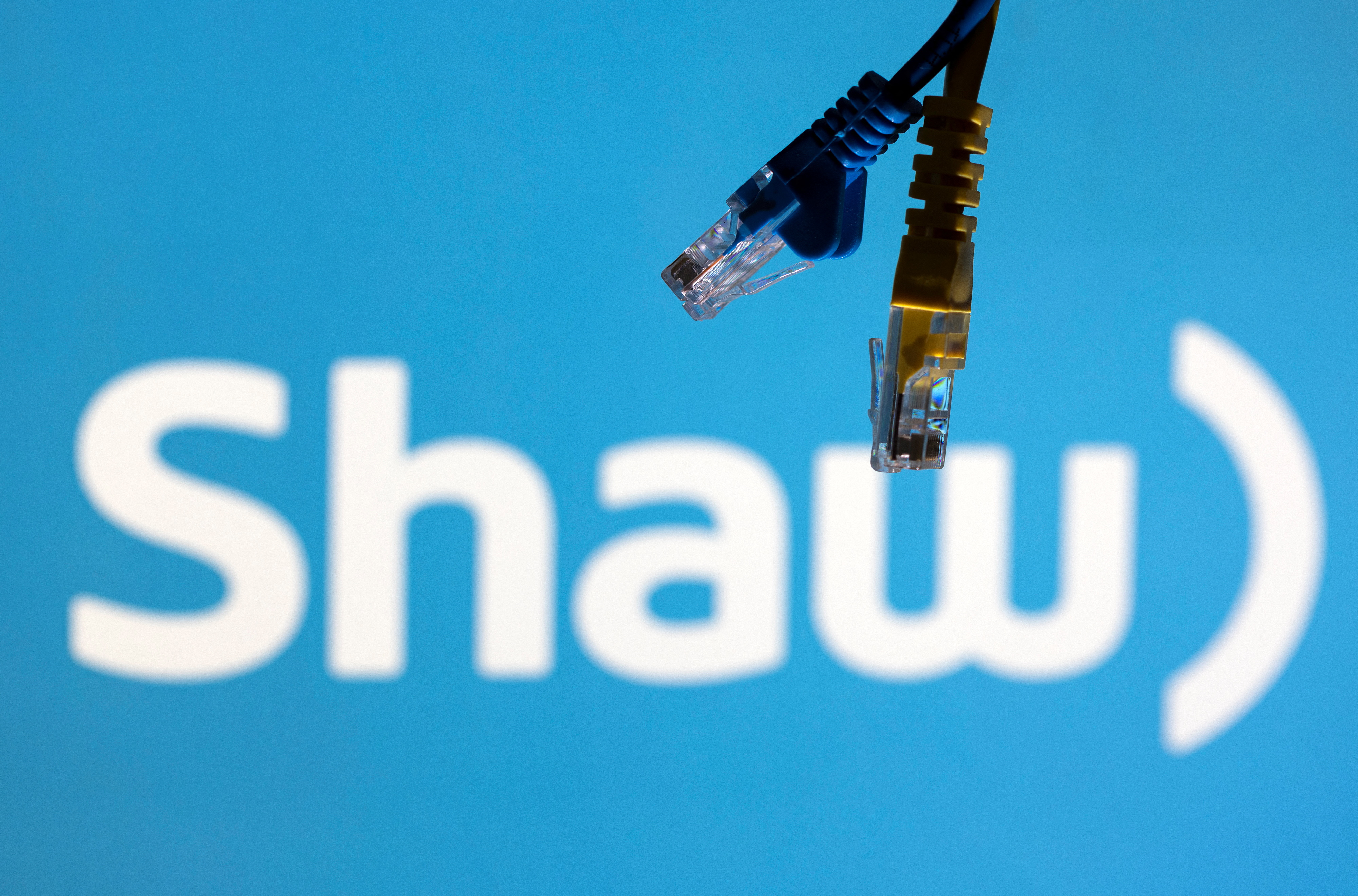 Illustration shows Shaw Communications logo