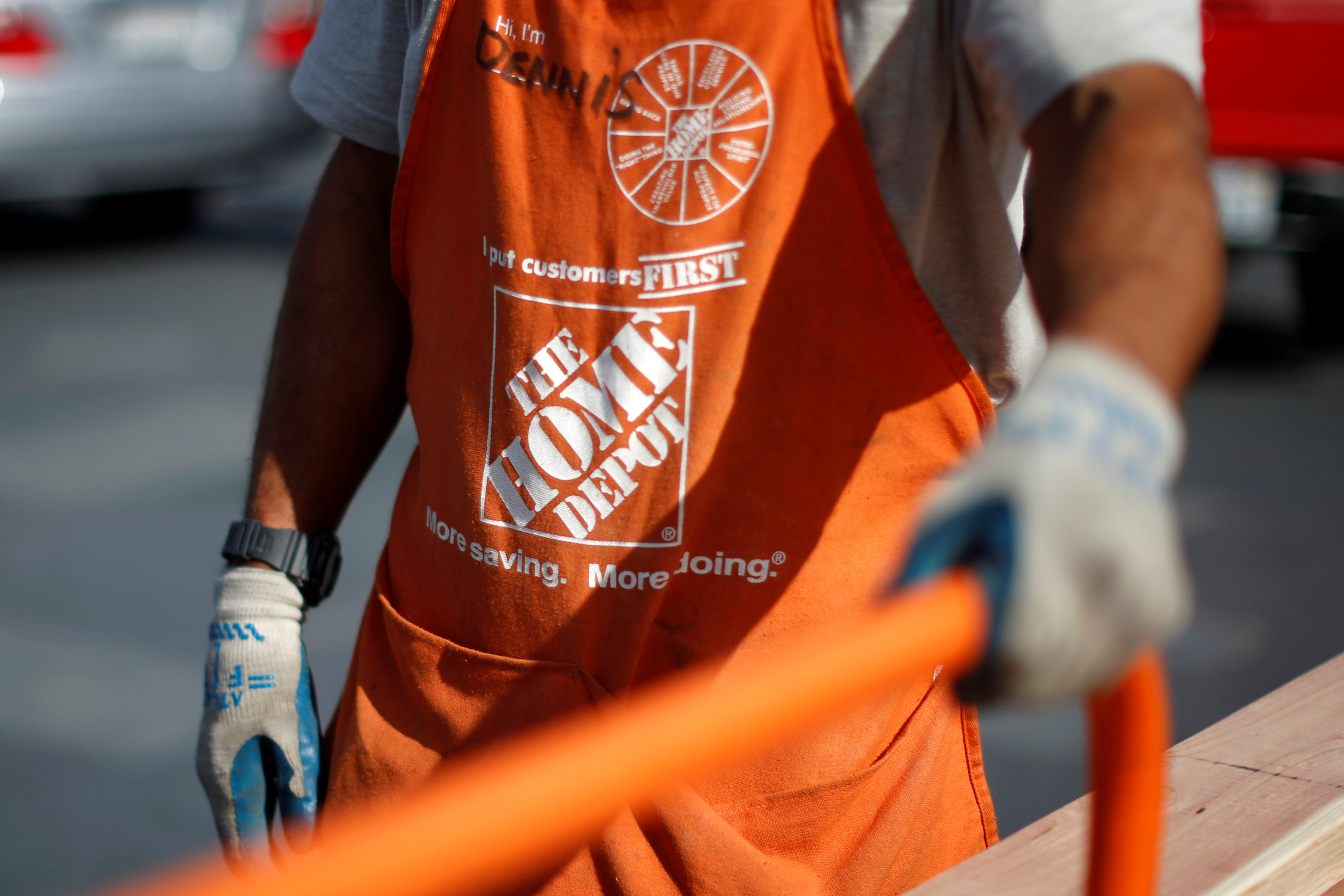 A Home Depot employee is seen outside a store in Los Angeles