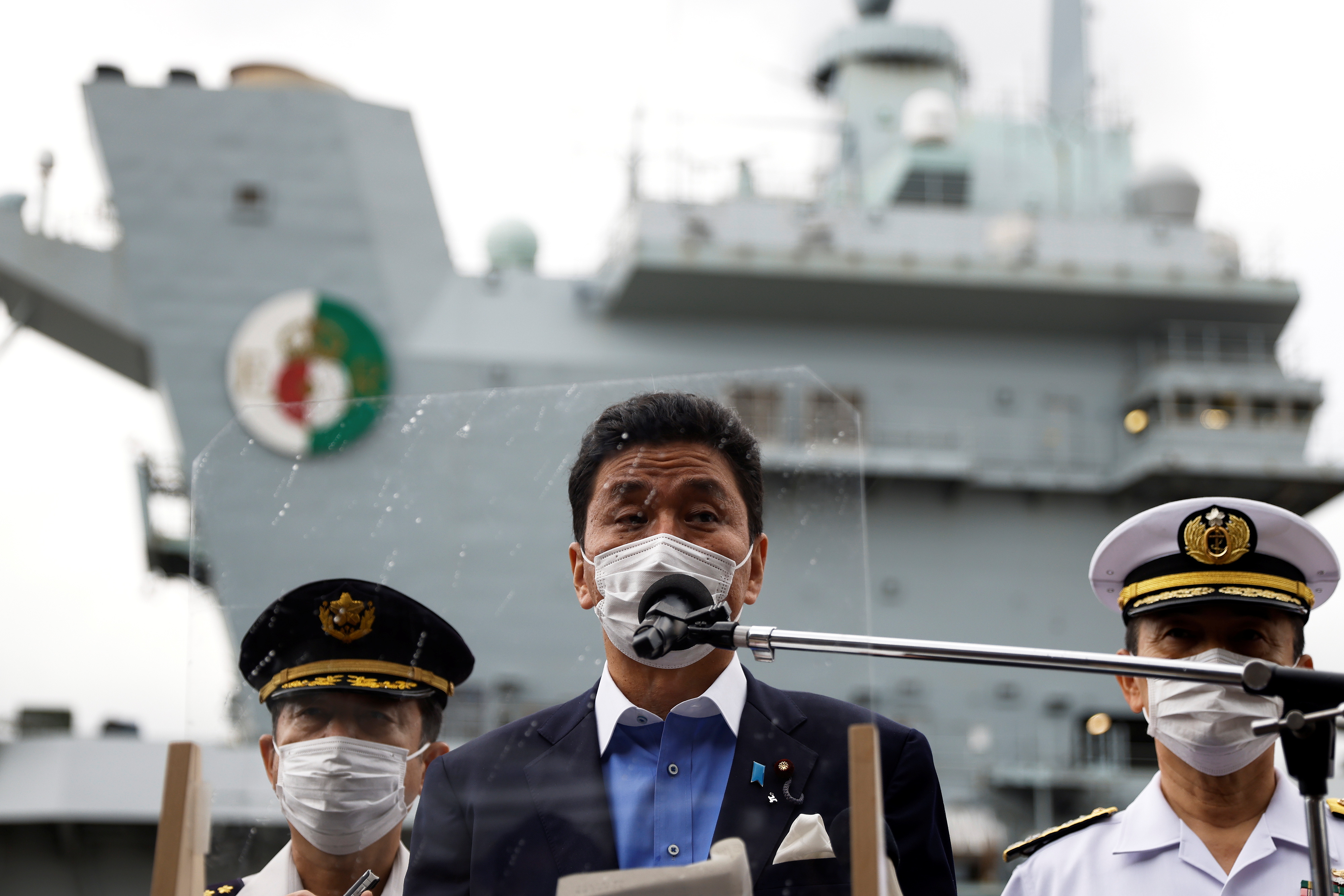 Japan's Defense Minister Nobuo Kishi tours the British Royal Navy's HMS Queen Elizabeth aircraft carrier in Yokosuka