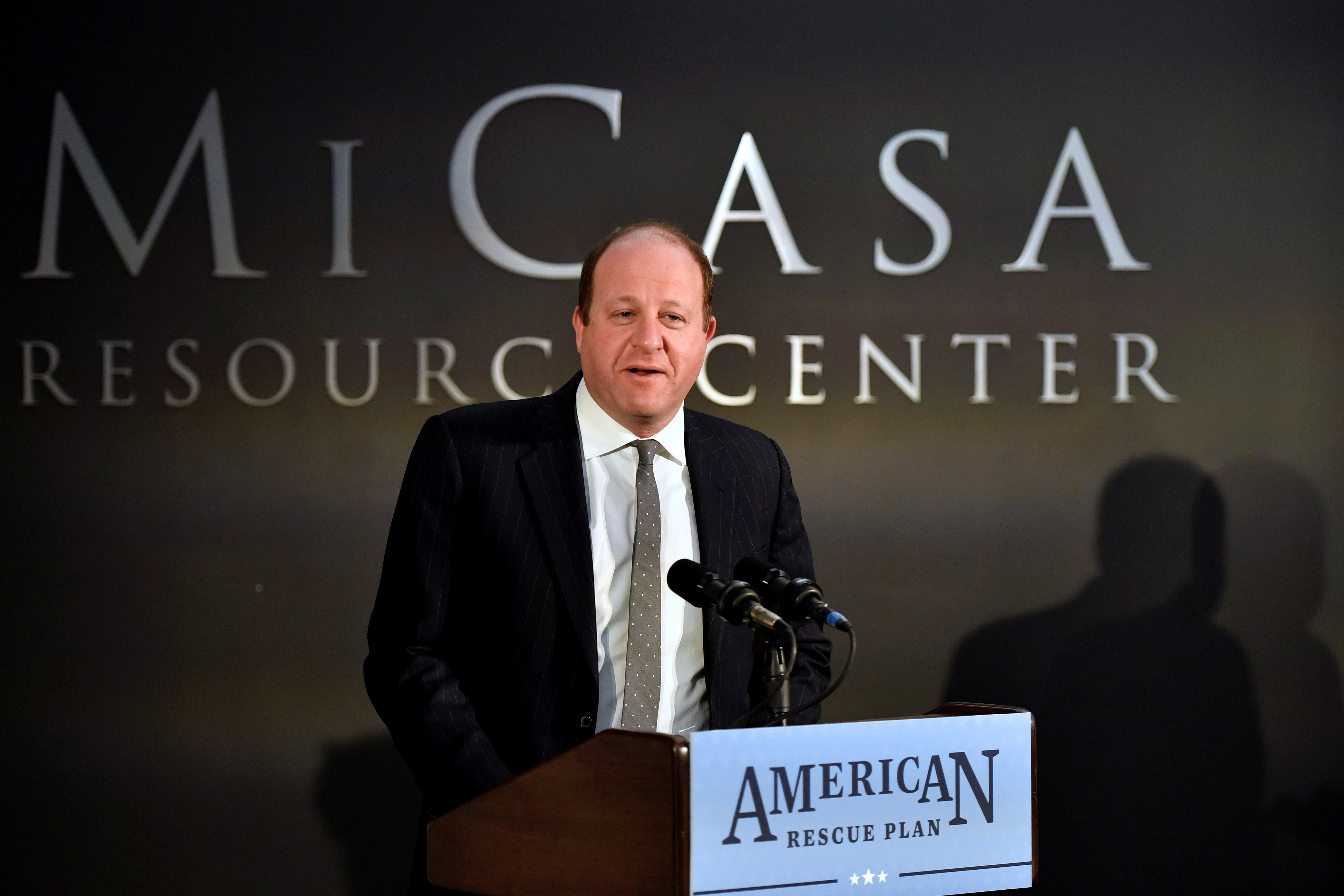 Colorado Governor Jared Polis speaks about the American Rescue Plan Act on the one year anniversary of the law during his visit to Mi Casa Resource Center in Denver
