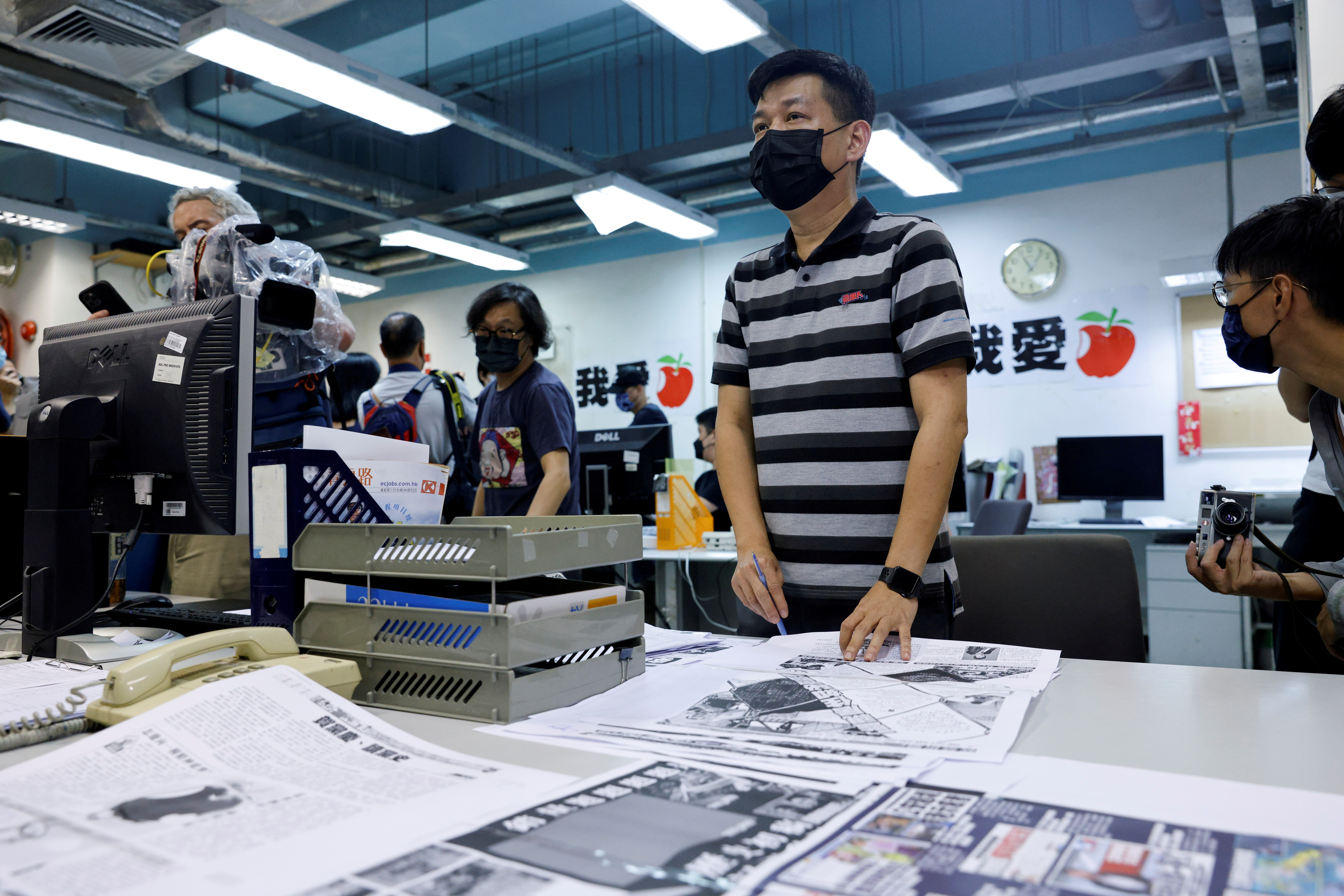 Staff members of Apple Daily work on their final edition in Hong Kong
