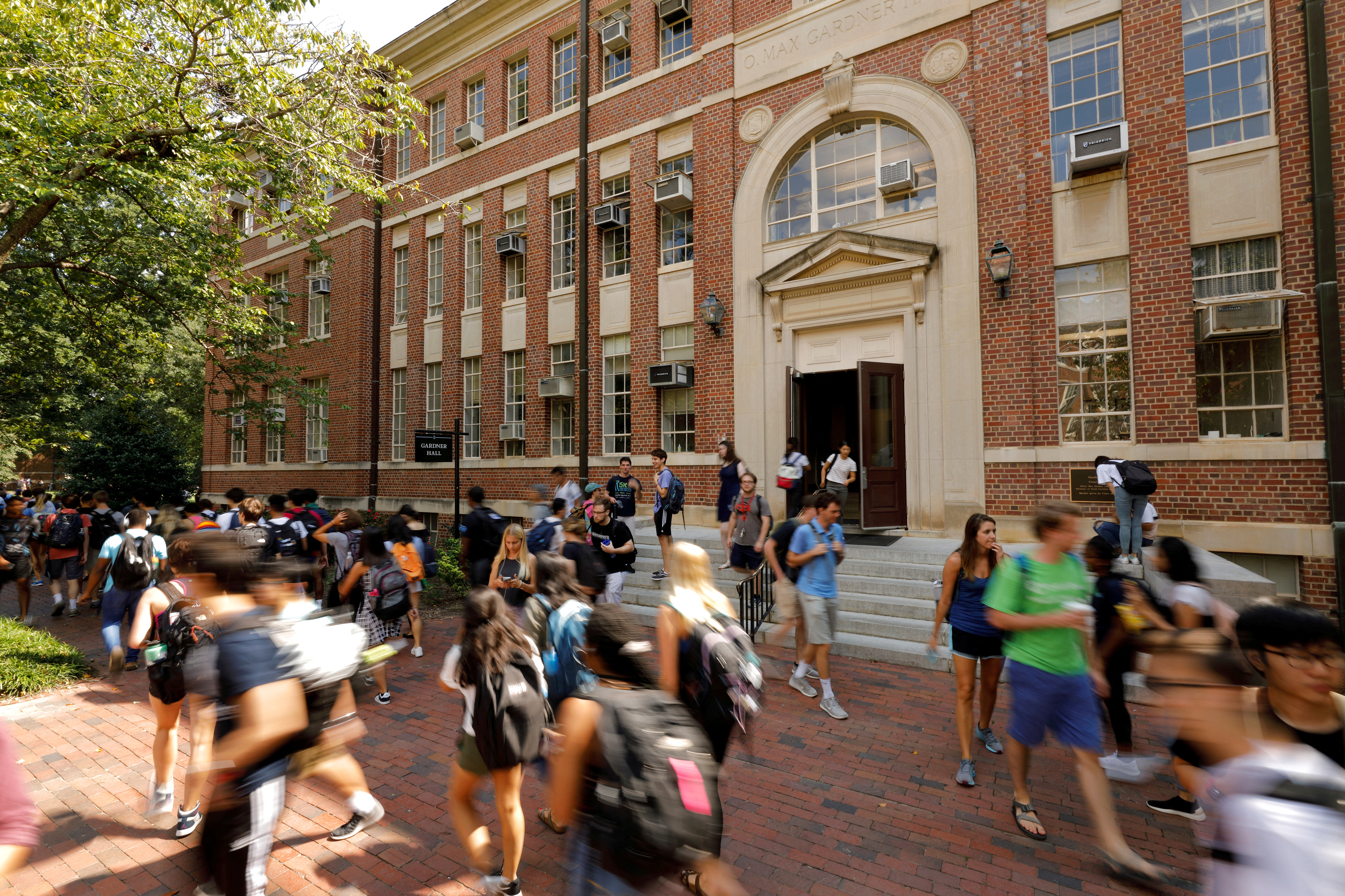 Students walk past a classroom building on the campus of the University of North Carolina at Chapel Hill North Carolina