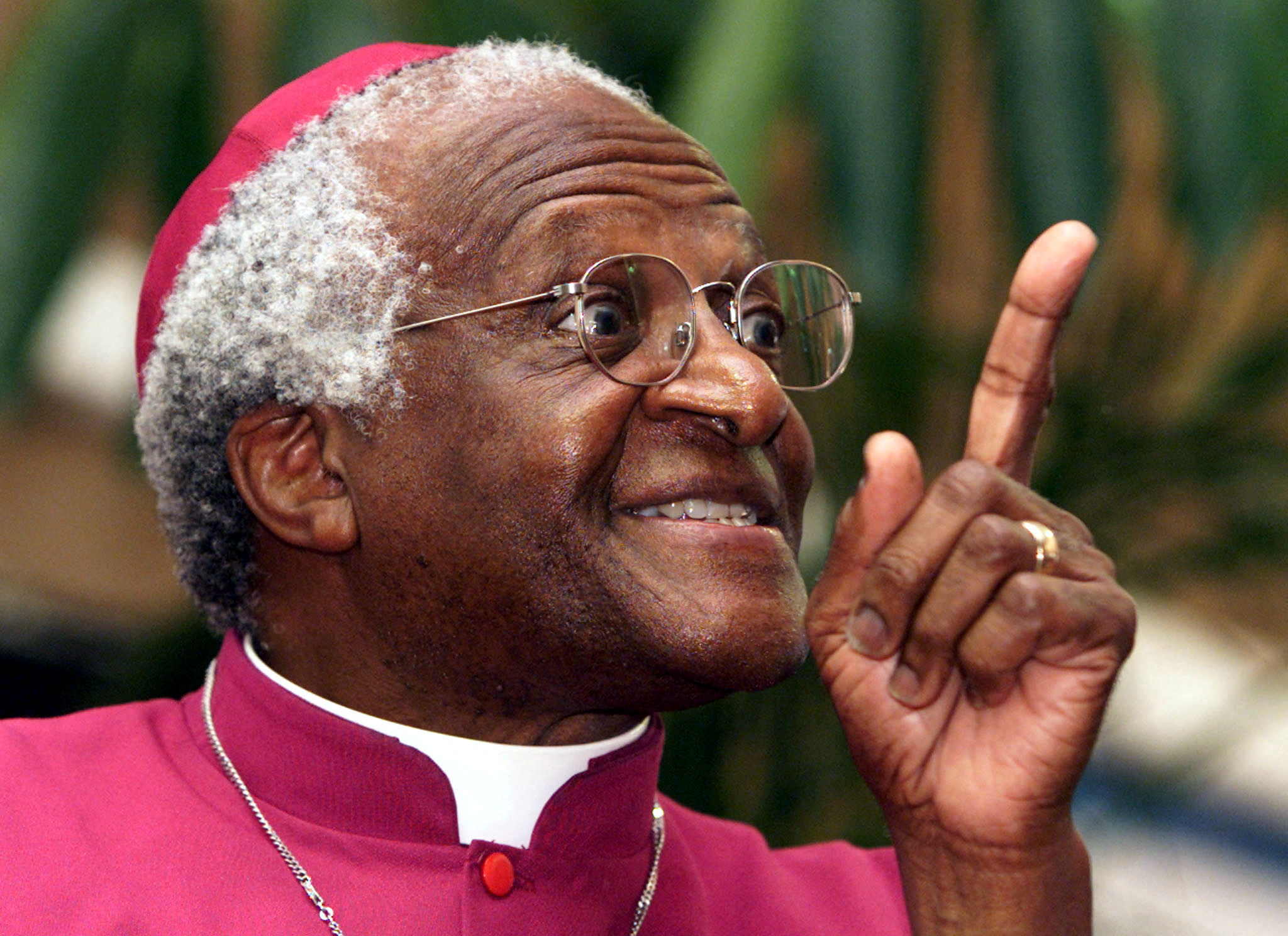 Archbishop Desmond Tutu makes a point as he addresses a meeting March 16, 2001 to raise awareness fo..