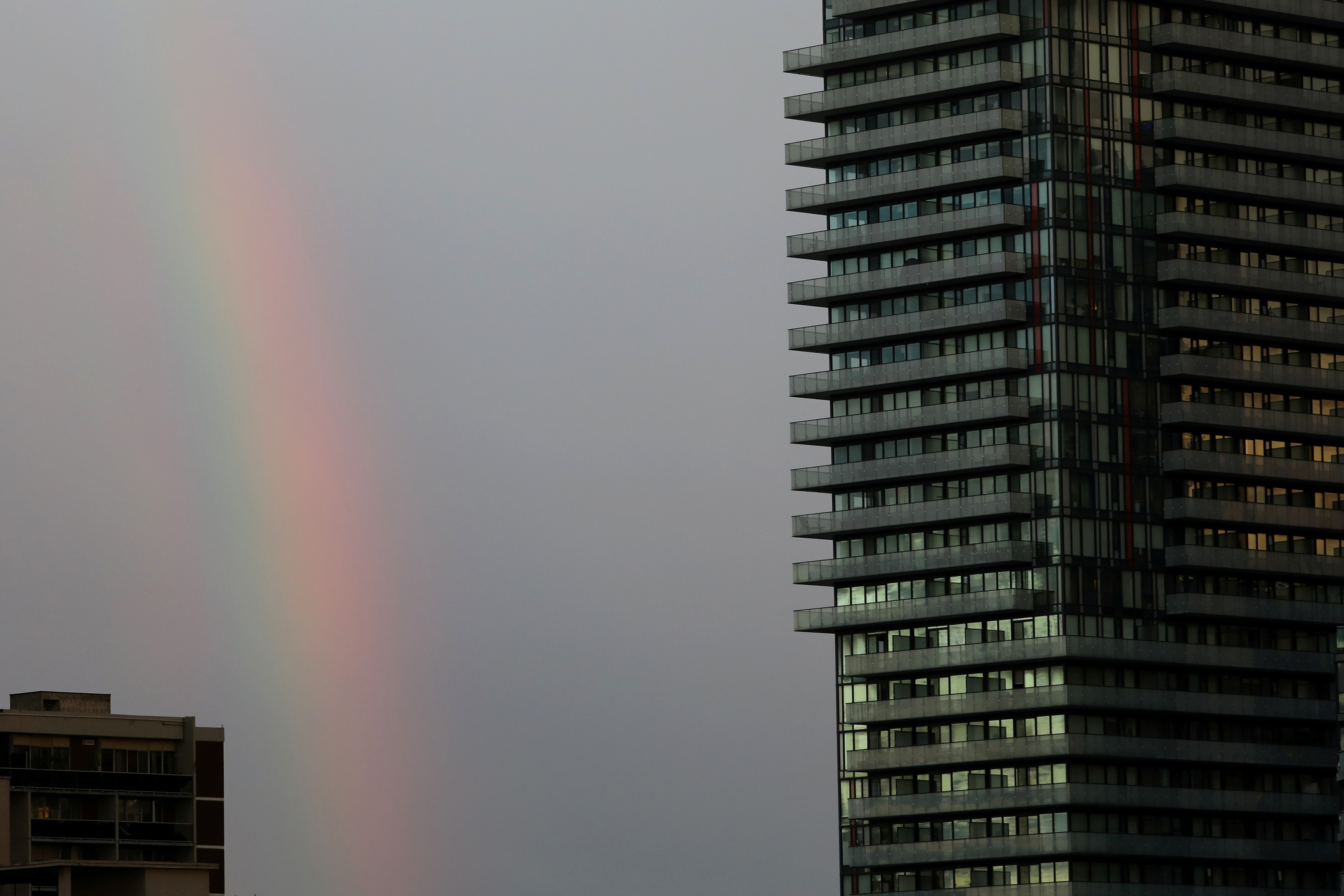 Rainbow appears past a condominium building in Toronto, Ontario, Canada October 16, 2021.  REUTERS/Chris Helgren 