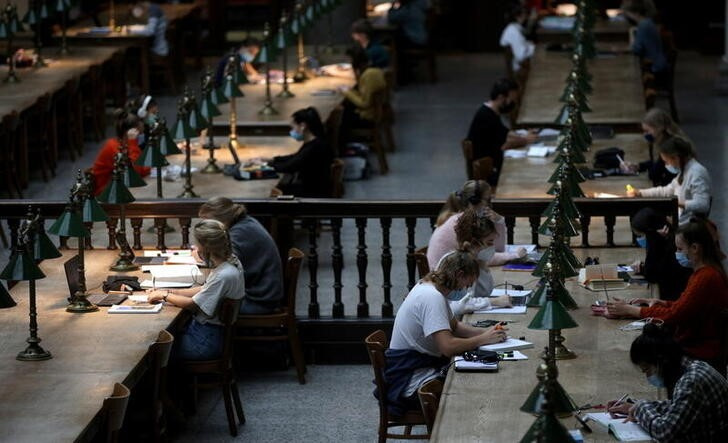 Students wearing face masks keep social distance as they study at the large reading room of Vienna University Library amid the coronavirus disease (COVID-19) outbreak, in Vienna