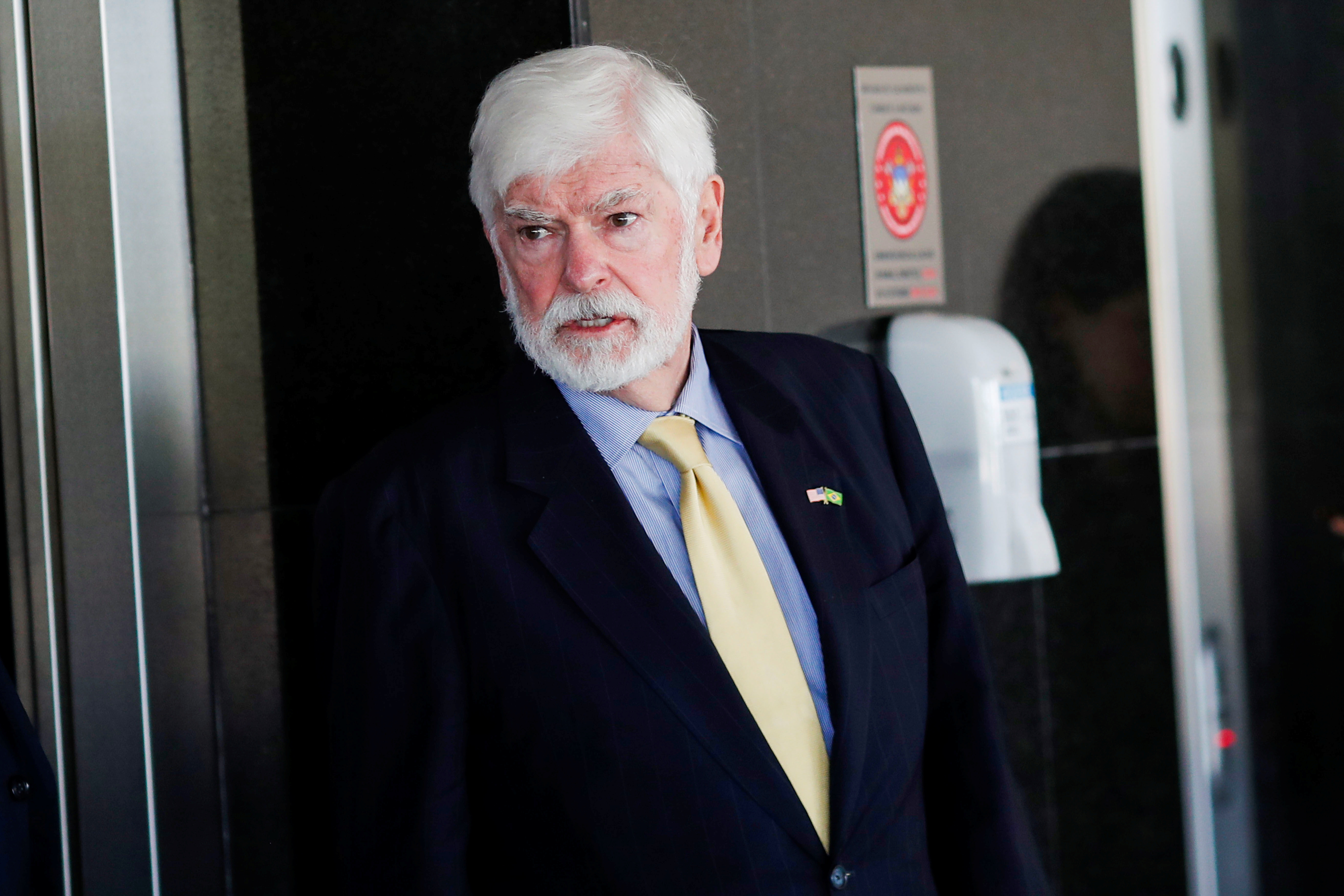 Special Advisor for the Summit of the Americas, Chris Dodd walks after meeting with Brazil's President Jair Bolsonaro (not pictured) at the Planato Palace, in Brasilia
