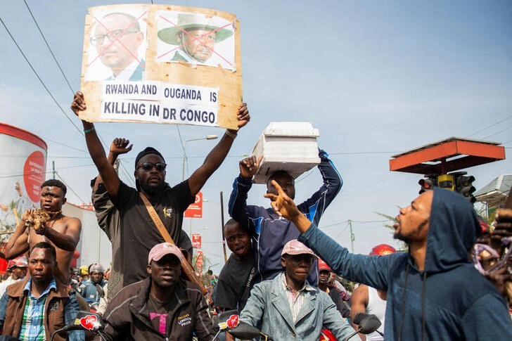 Civilians participate in a protest in support of the FARDC in Goma
