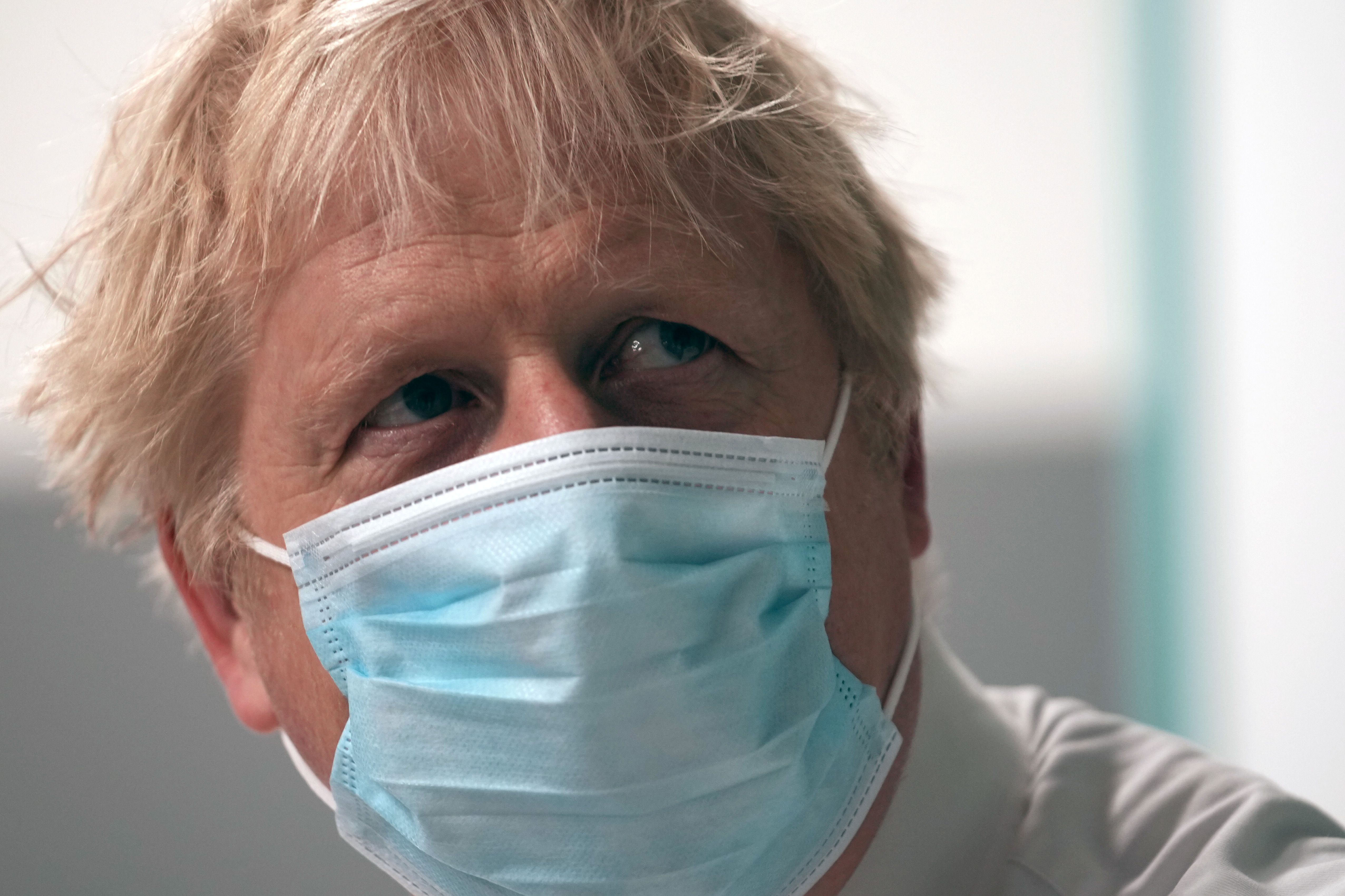 Prime Minister Boris Johnson looks on during a visit at Leeds General Infirmary, in Leeds, Britain October 2, 2021. Christopher Furlong/Pool via REUTERS
