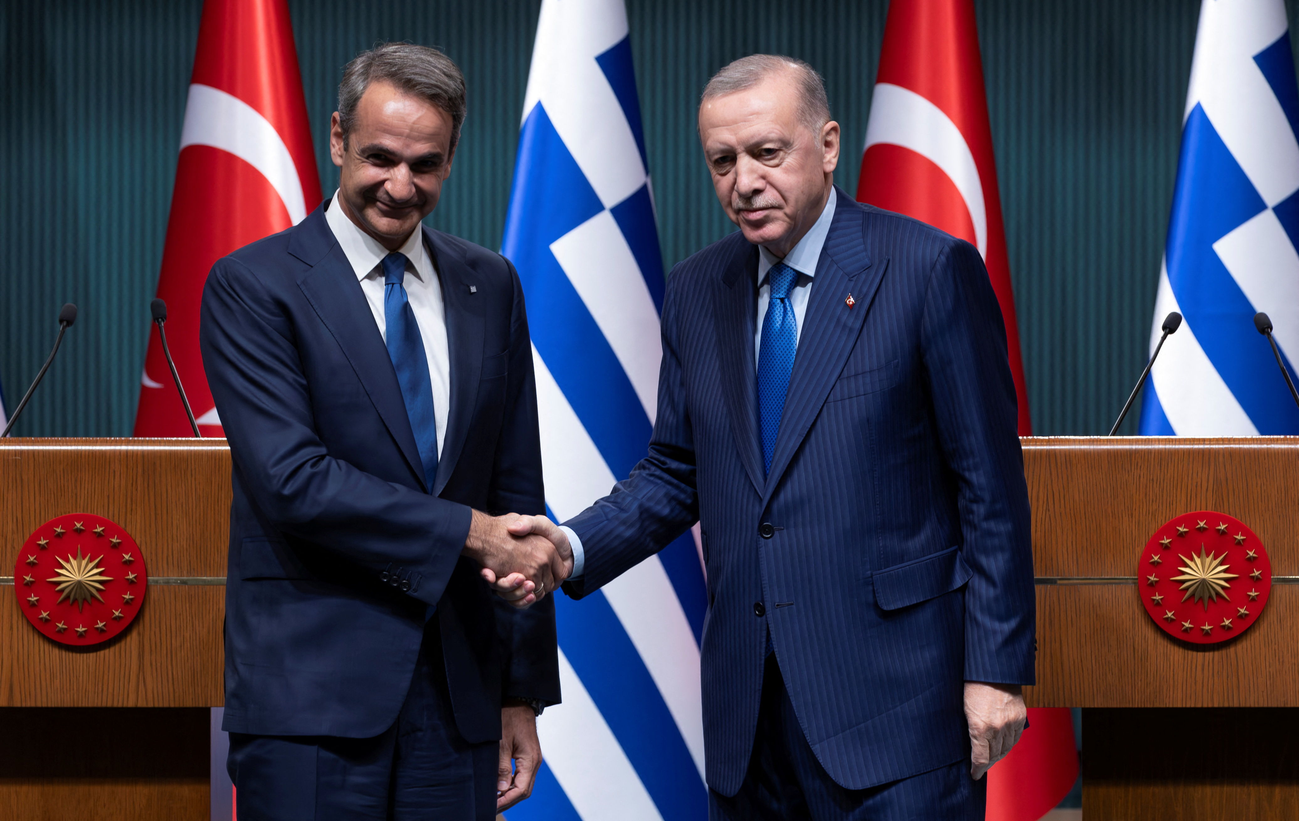 Turkey's President Tayyip Erdogan and Greek Prime Minister Kyriakos Mitsotakis attend a press conference in Ankara