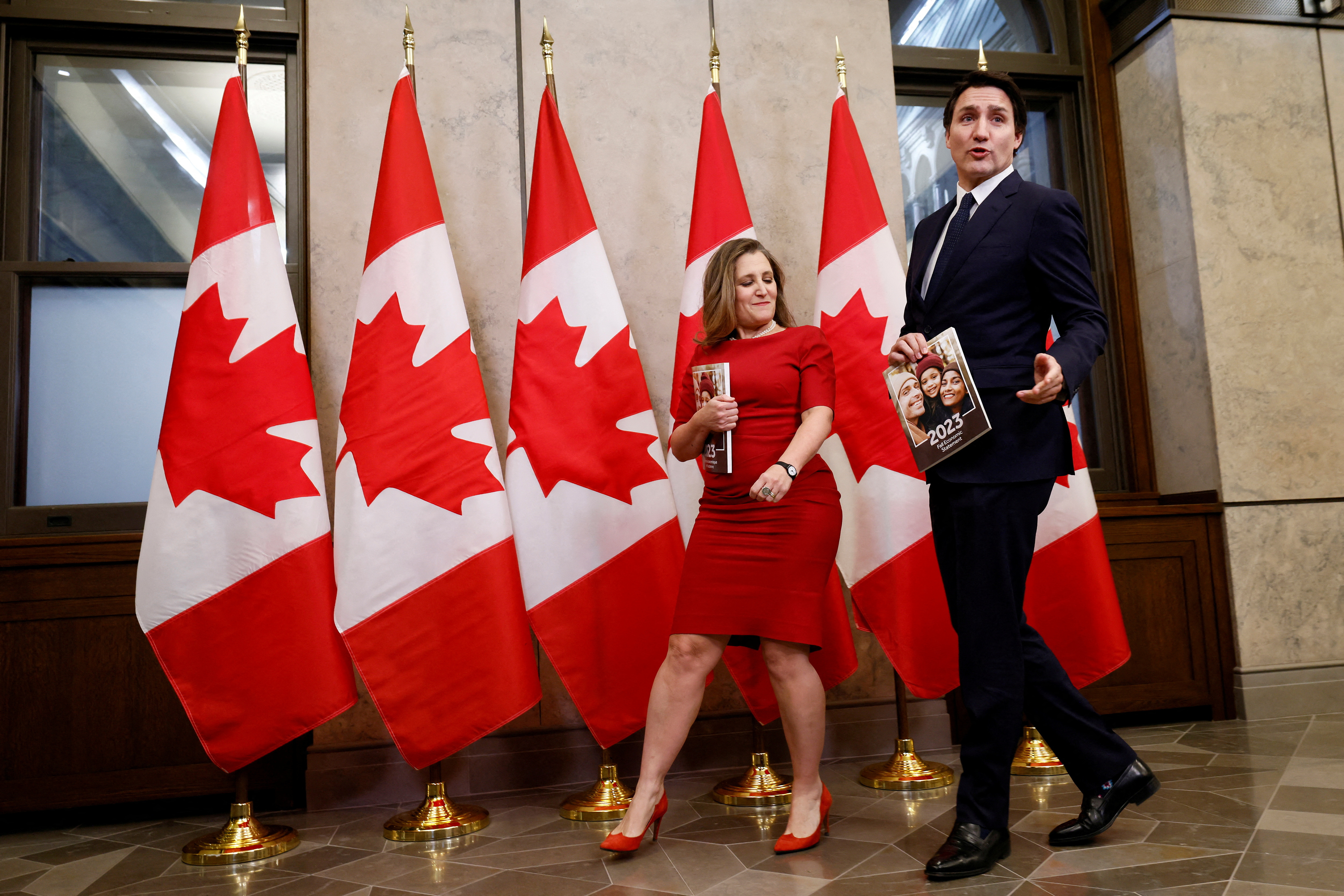 Canada's Deputy Prime Minister and Minister of Finance Chrystia Freeland and Prime Minister Justin Trudeau walk together before delivering the fall economic statement in Ottawa