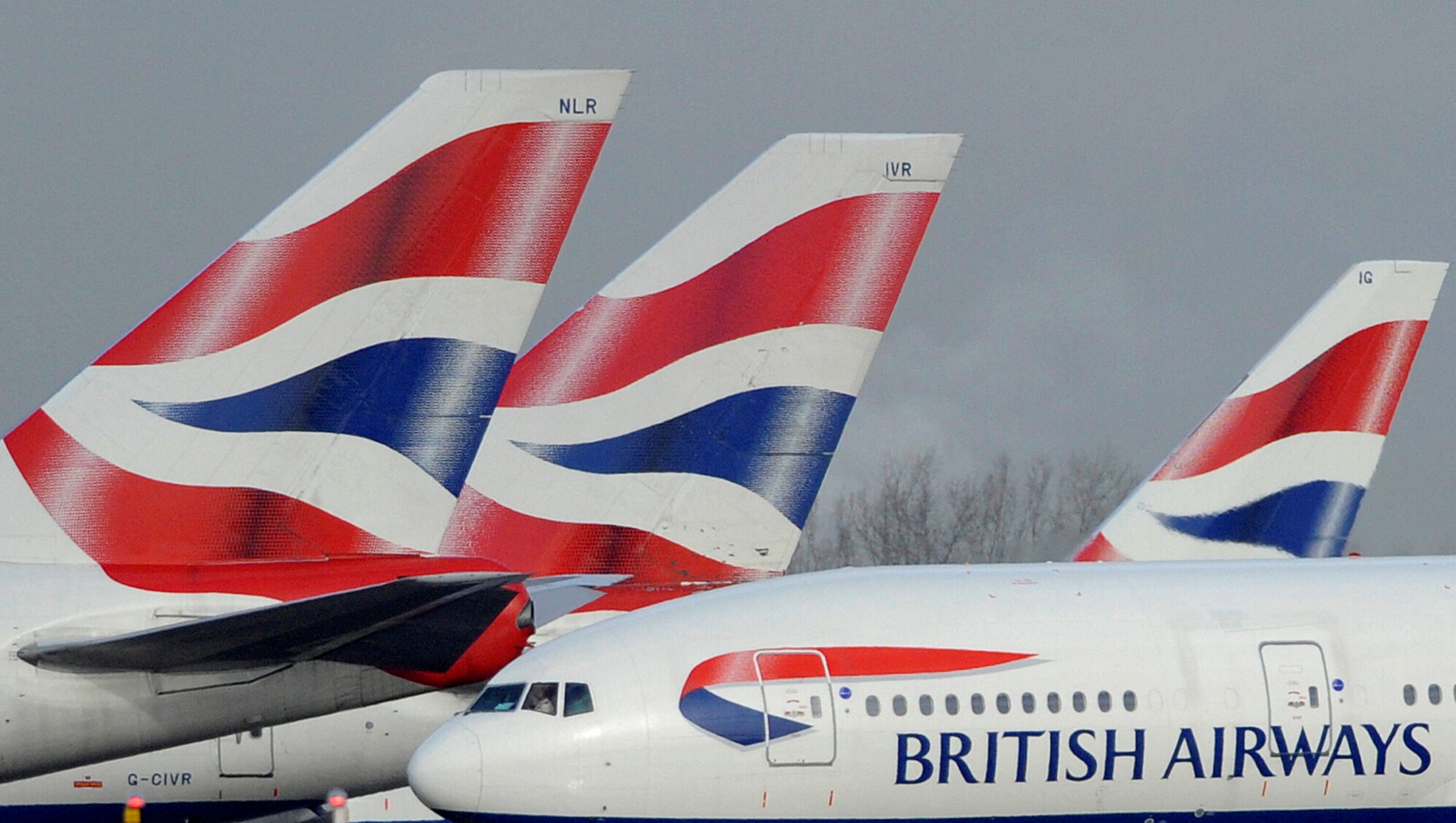 British Airways aircraft are parked at Heathrow Airport in west London