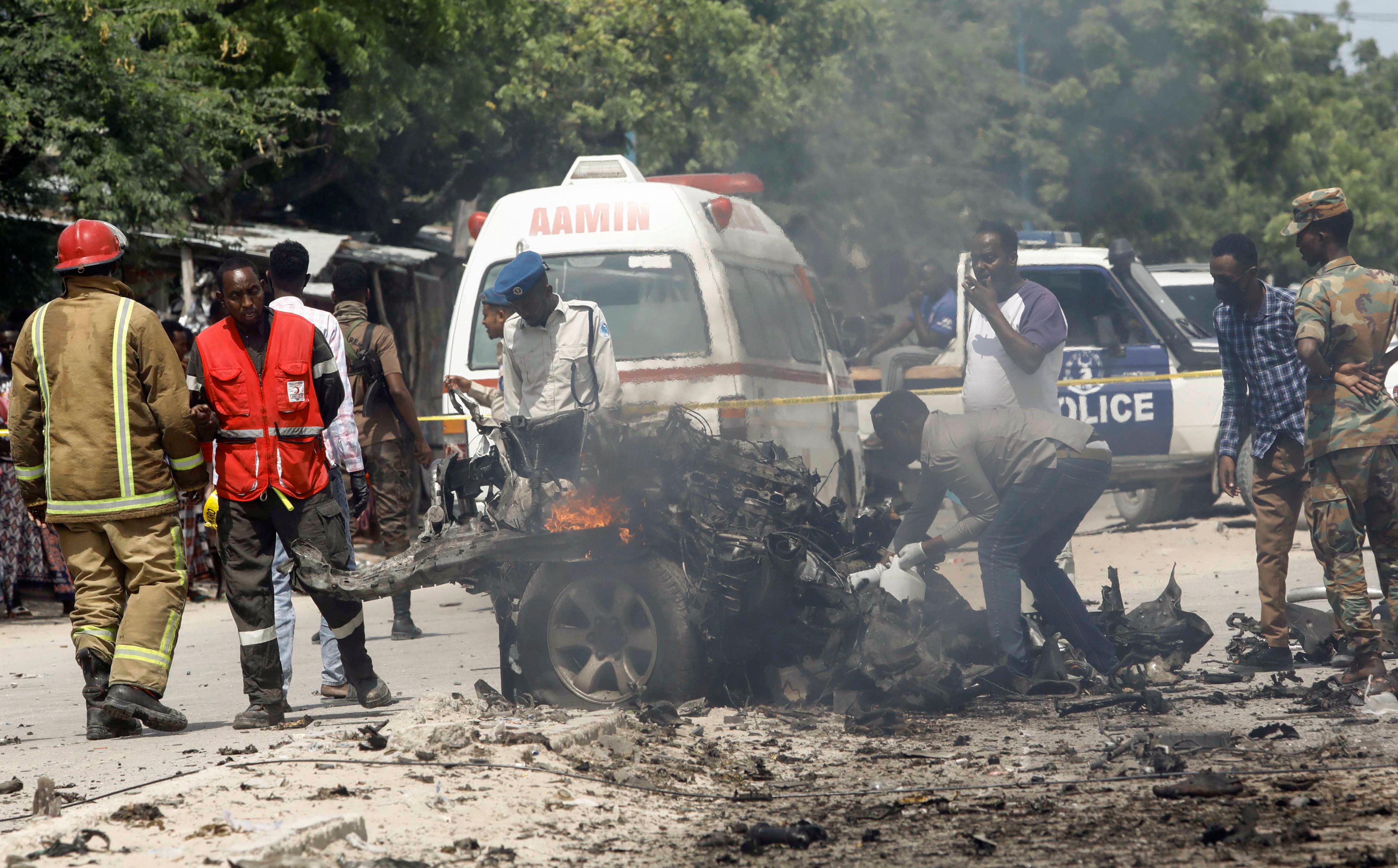 Rescuers, security and paramedics are seen at the scene of a car explosion near Banadir hospital in Mogadishu, Somalia July 10, 2021. REUTERS/Feisal Omar