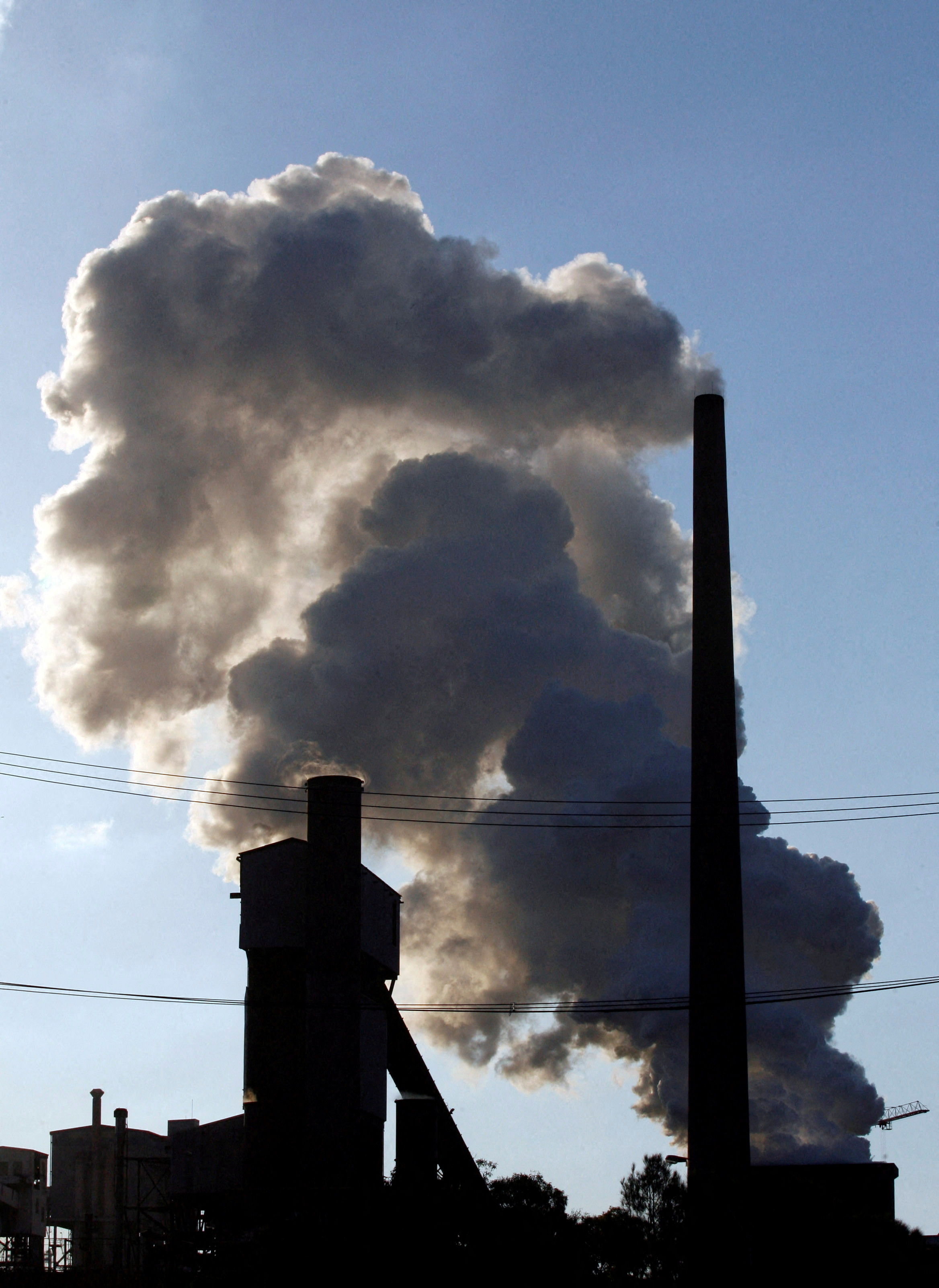 Emissions are released from a factory chimney at an industrial park in Wollongong