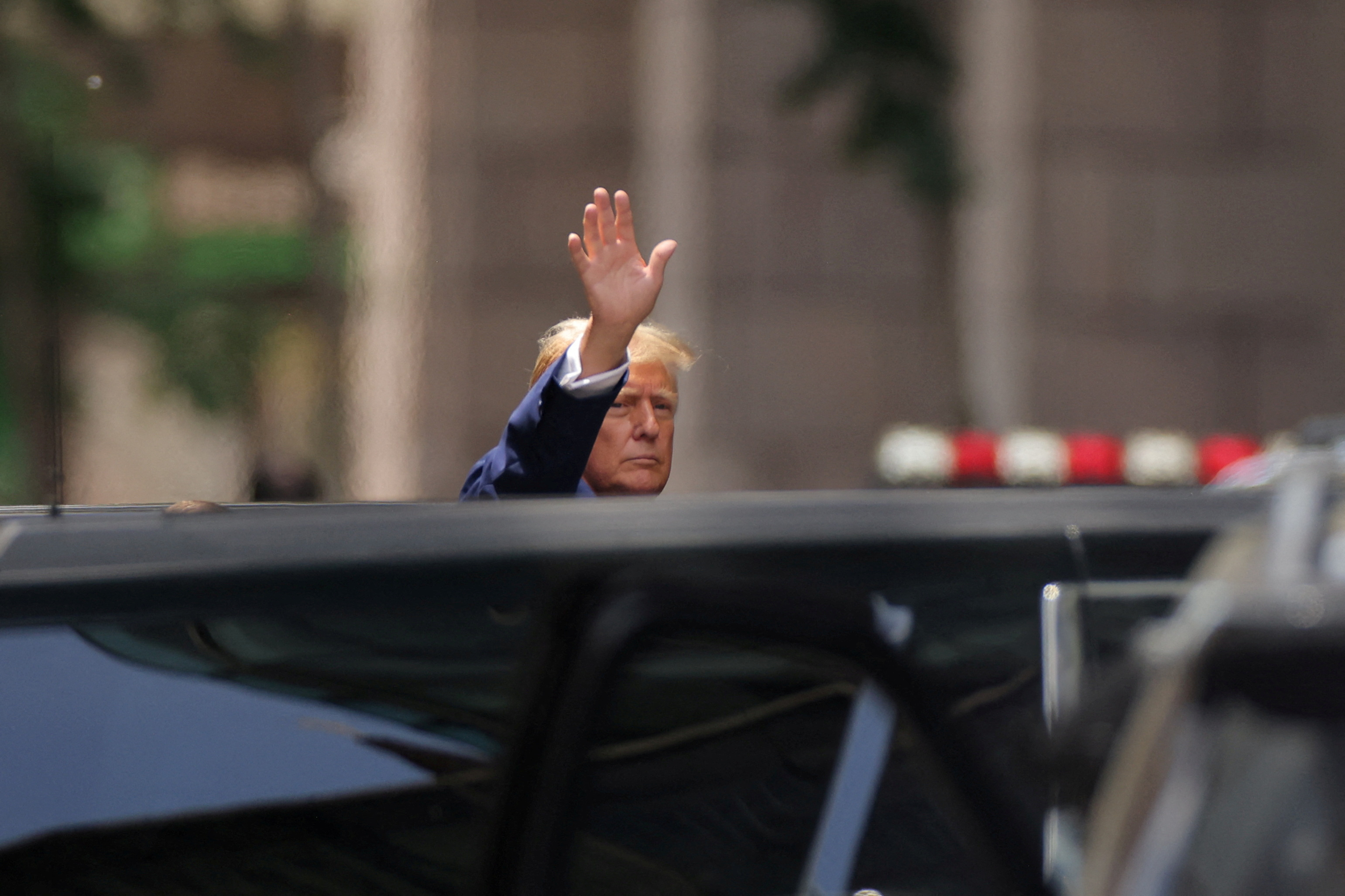 Former U.S. President walks outside Trump Tower, in New York