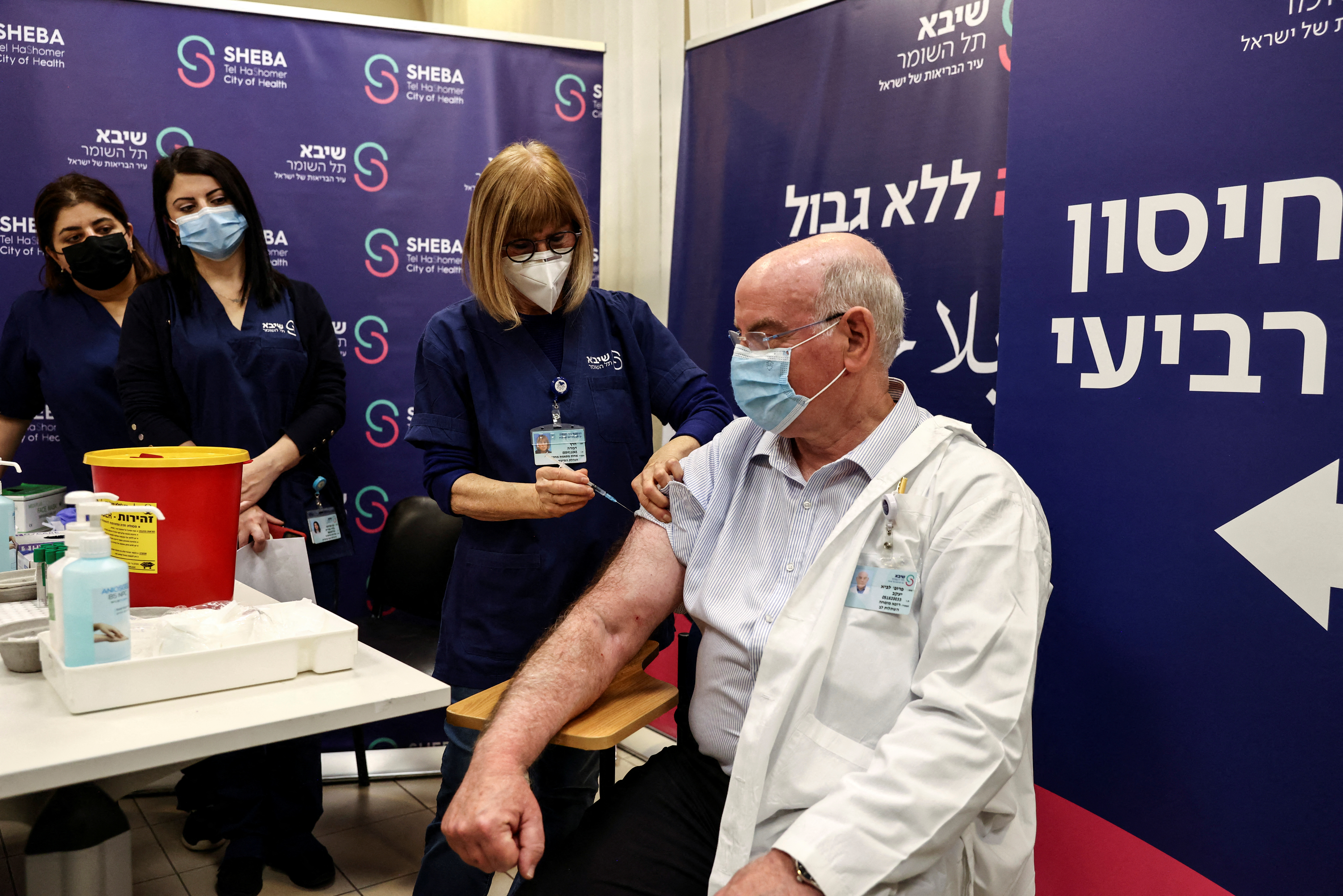 Professor Jacov Lavee receives a fourth dose of coronavirus disease (COVID-19) vaccine as part of a trial in Israel, as Health Ministry is considering offering the second booster to the elderly and immuno-compromised at Sheba Medical Center in Ramat Gan