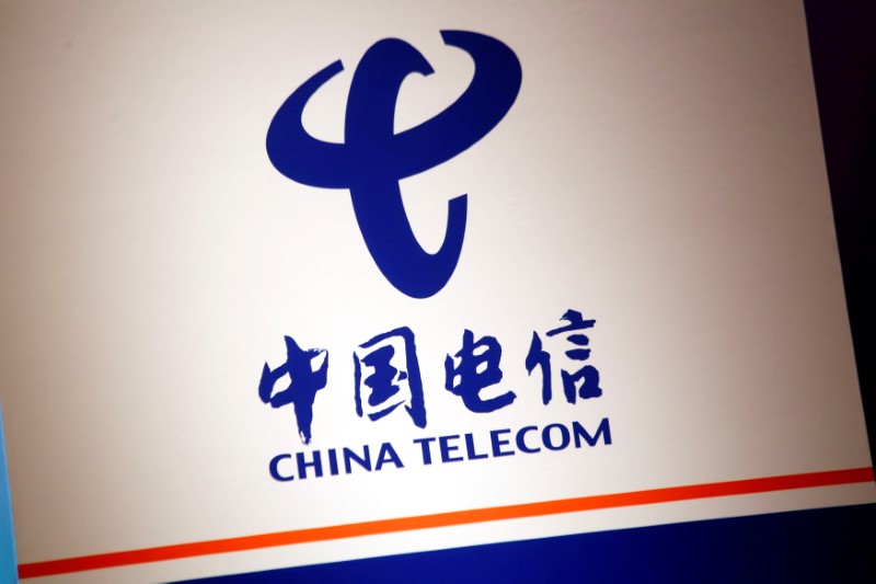 The company logo of China Telecom is displayed at a news conference in Hong Kong