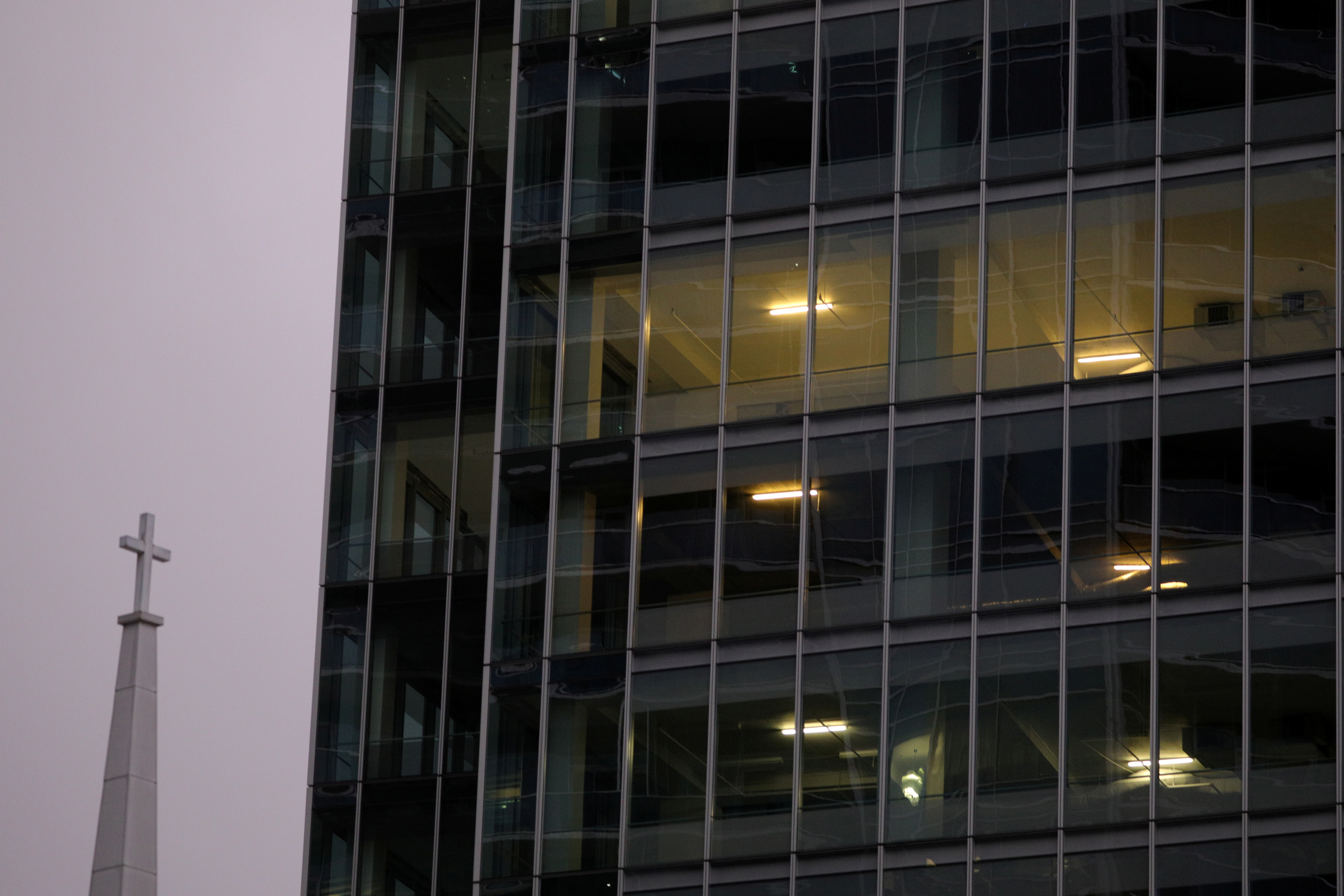 Office lights are illuminated in a high rise building at dusk, as Governor Ralph Northam's (D-VA) stay-at-home order continues due to the coronavirus disease (COVID-19) outbreak, in the Rosslyn section of Arlington, Virginia, U.S., April 30, 2020. REUTERS/Tom Brenner