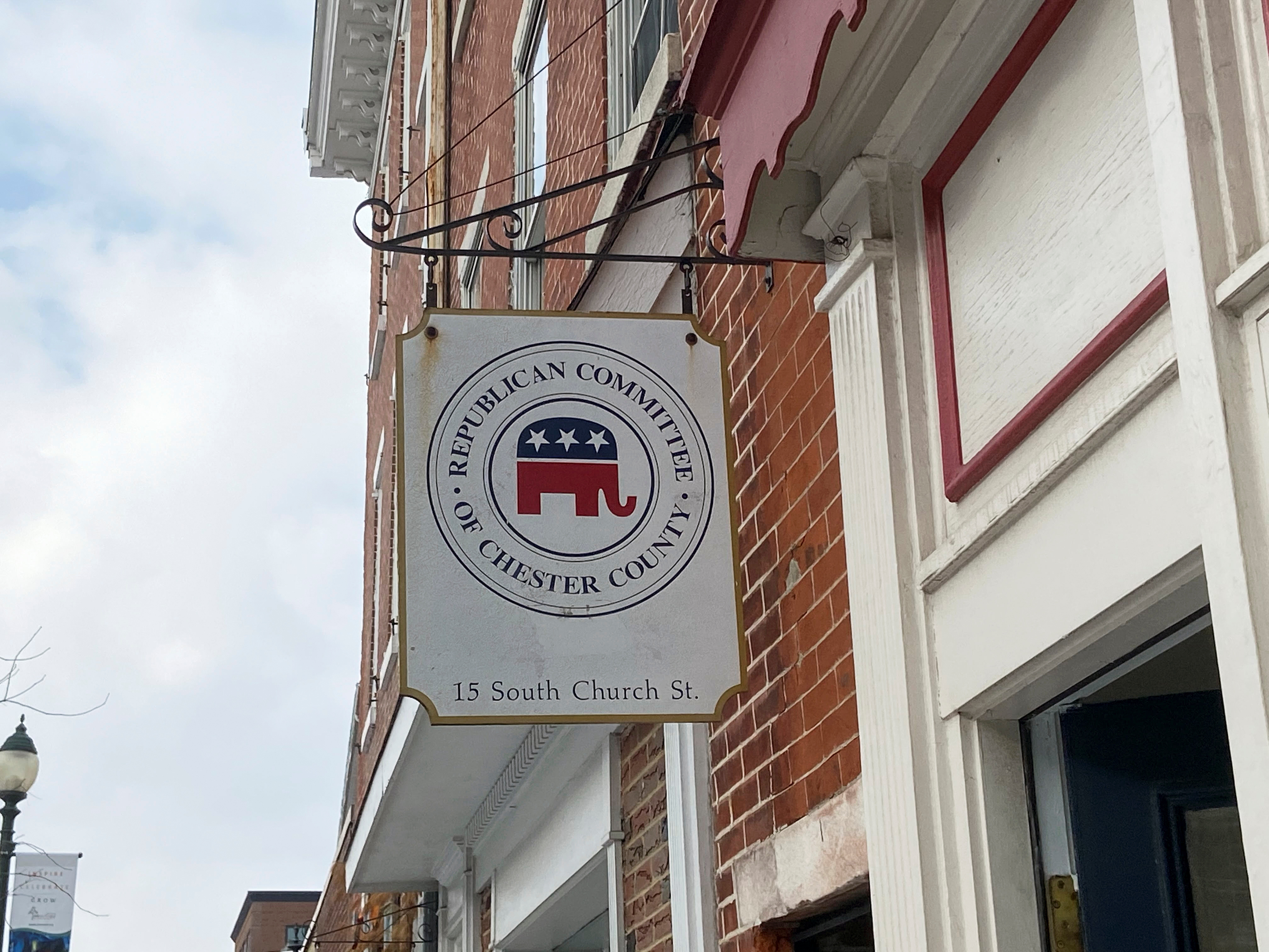 A sign hangs outside the headquarters of the Republican Committee of Chester County, Pennsylvania in downtown West Chester