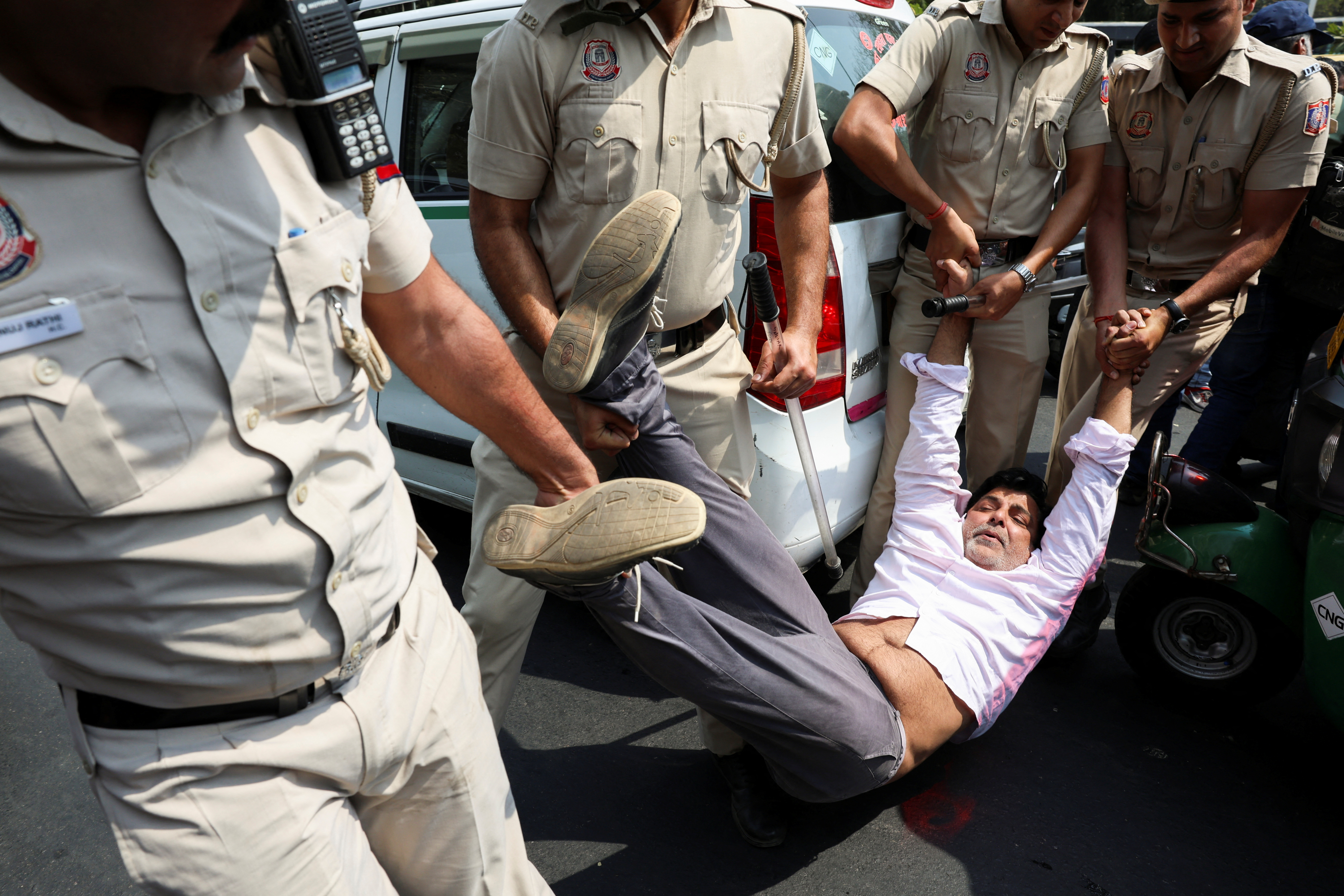 AAP supporters protest after the party's main leader and Delhi CM Arvind Kejriwal's arrest, in New Delhi