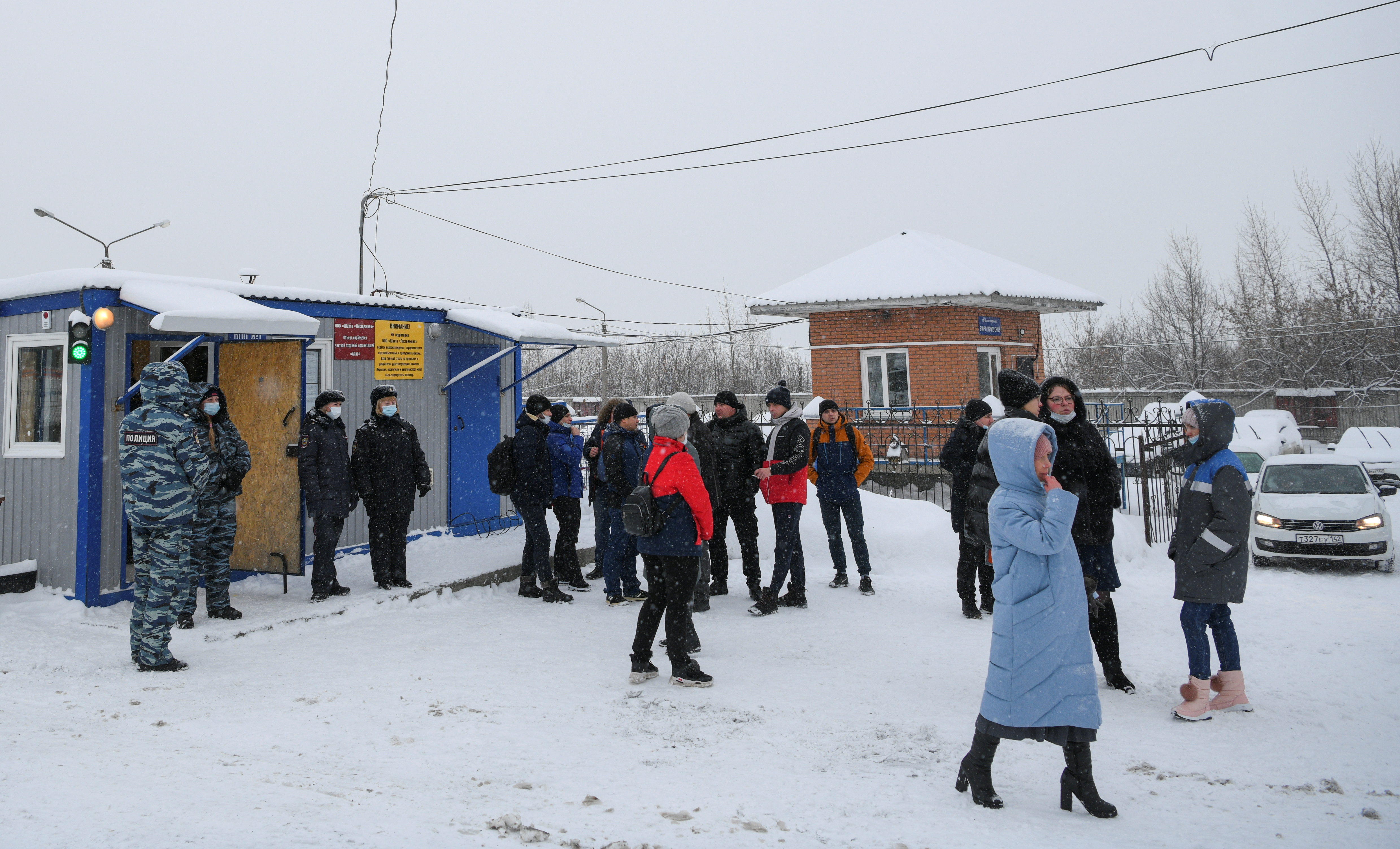 People gather near an entrance during a rescue operation following a fire in a coal mine in the Kemerovo region