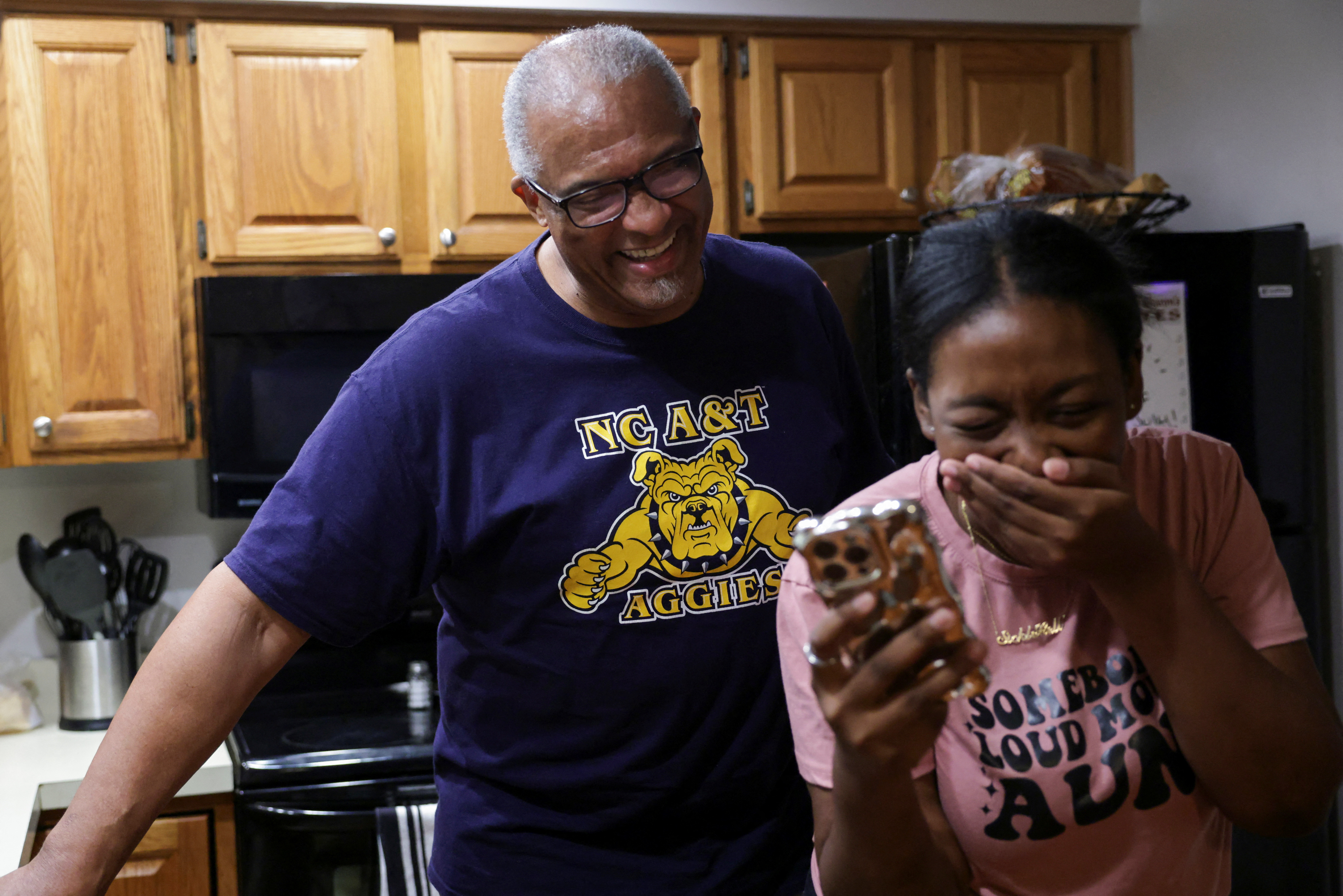 Kayla Smith Owens, who has sickle cell and advocates for awareness about the disease, shares a laugh with her grandfather at her grandparents' home in Chesapeake Beach