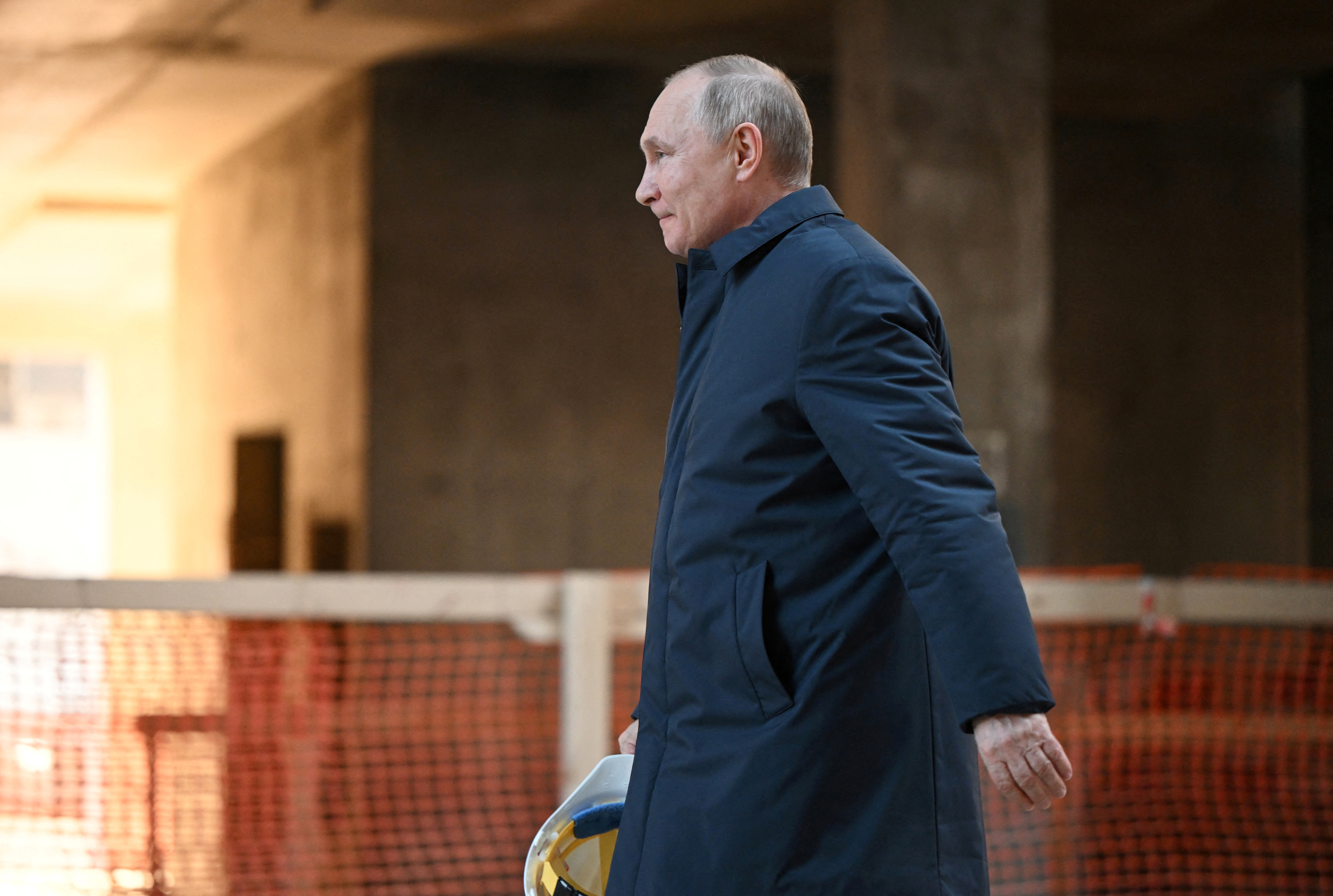 Russian President Vladimir Putin visits the construction site of the National Space Agency in Moscow