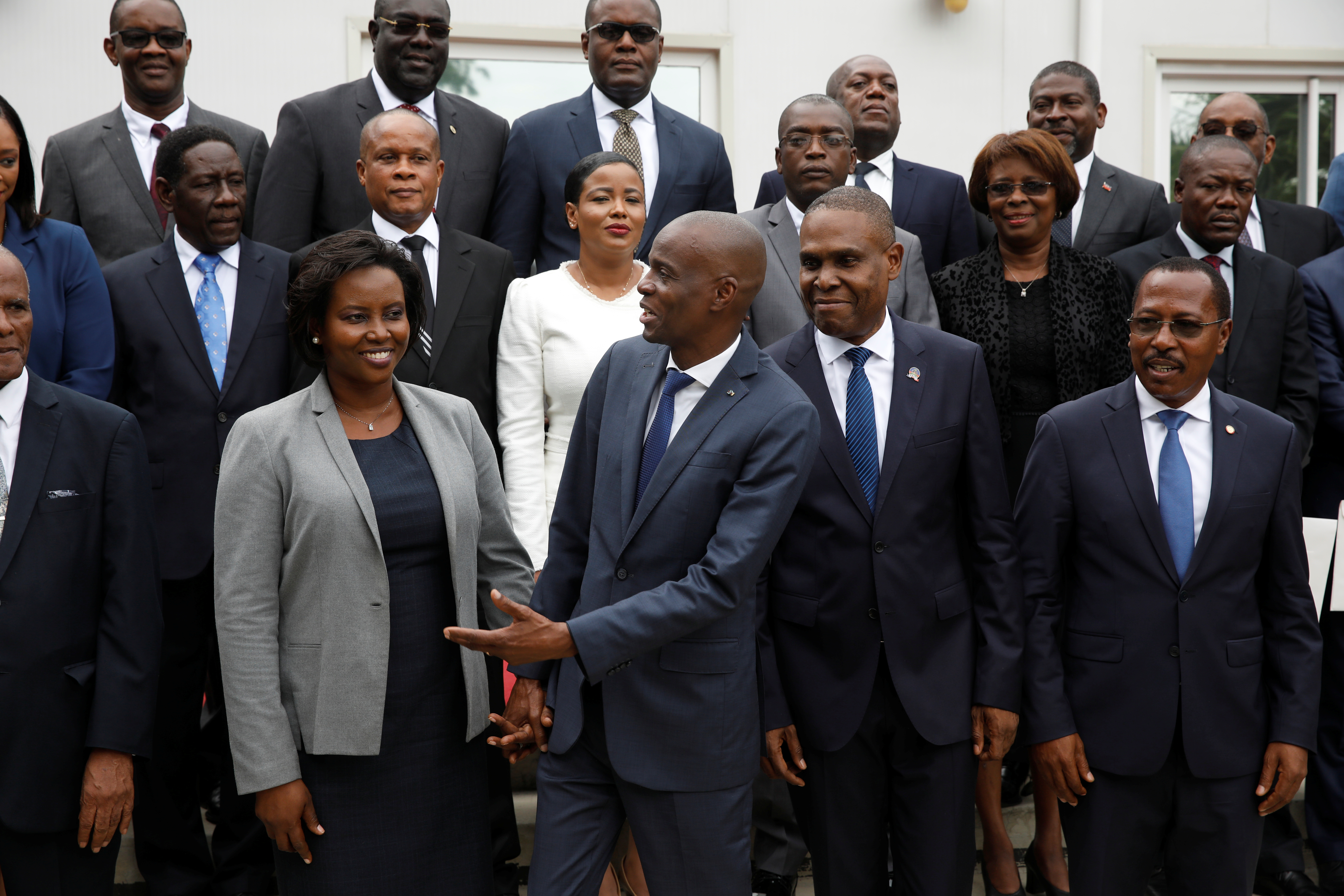 Haiti's President Moise, first lady Martine and PM Ceant pose for a picture with members of the Government in the gardens of the National Palace during the inauguration ceremony in Port-au-Prince