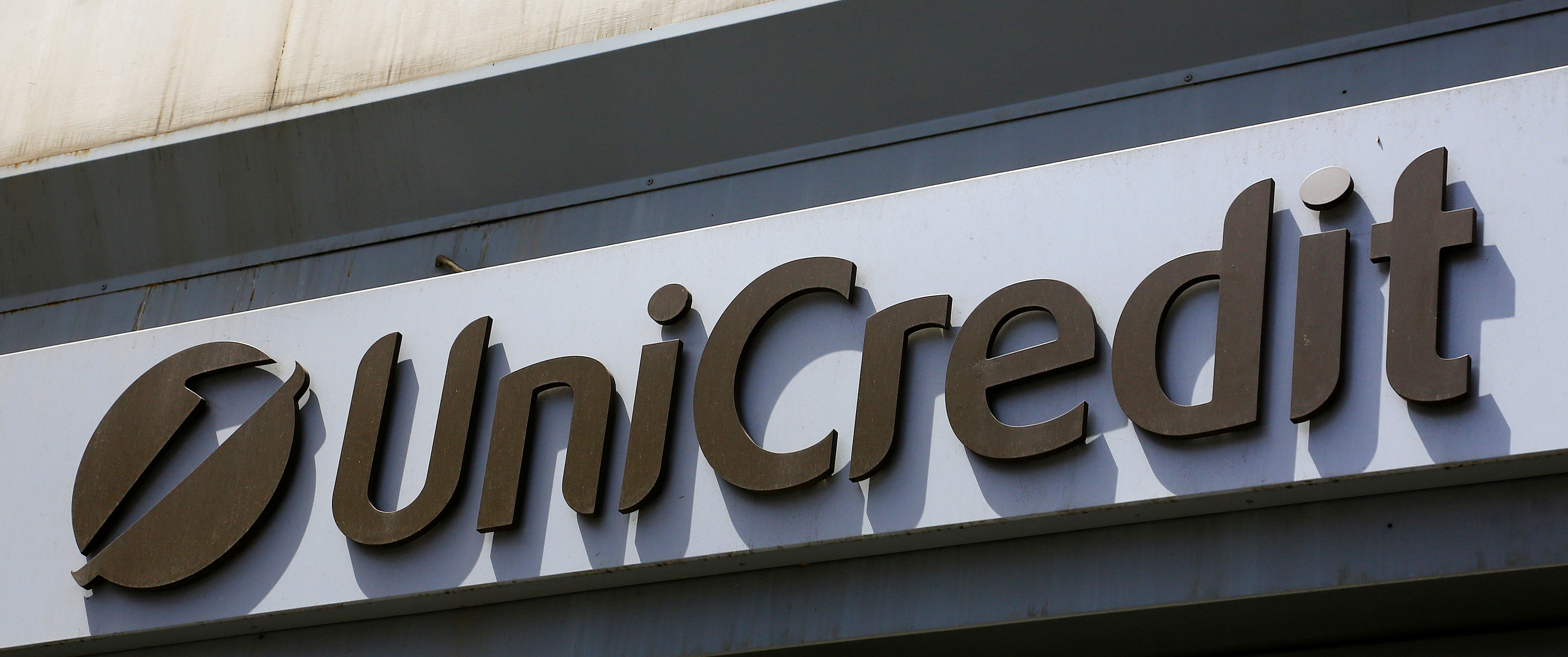 A UniCredit logo is seen in downtown Rome