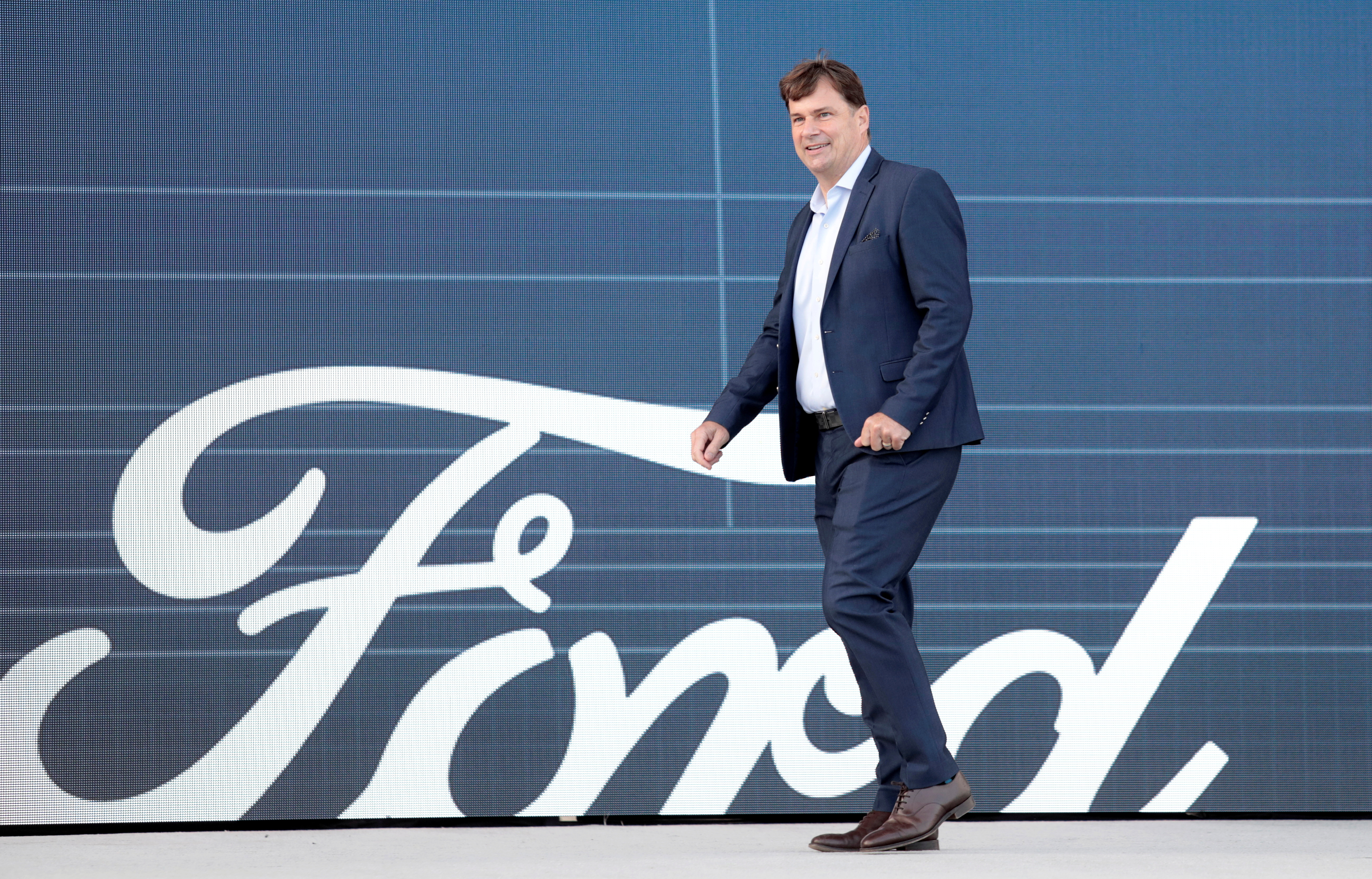 Ford Motor Co. CEO Jim Farley walks to speak at a news conference at the Rouge Complex in Dearborn, Michigan