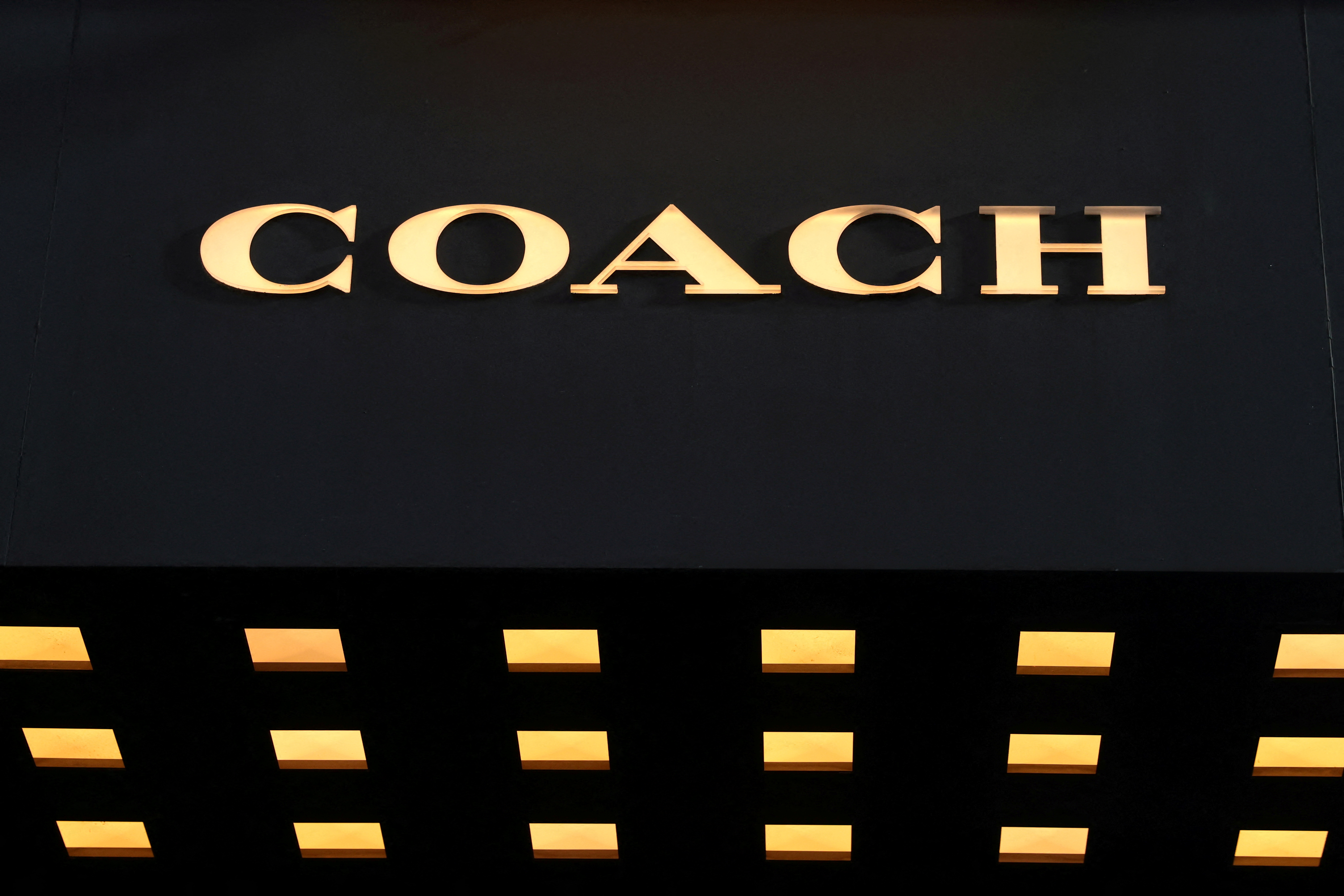 Signage is seen outside of a Coach store, a brand owned by Tapestry, Inc., in Manhattan, New York