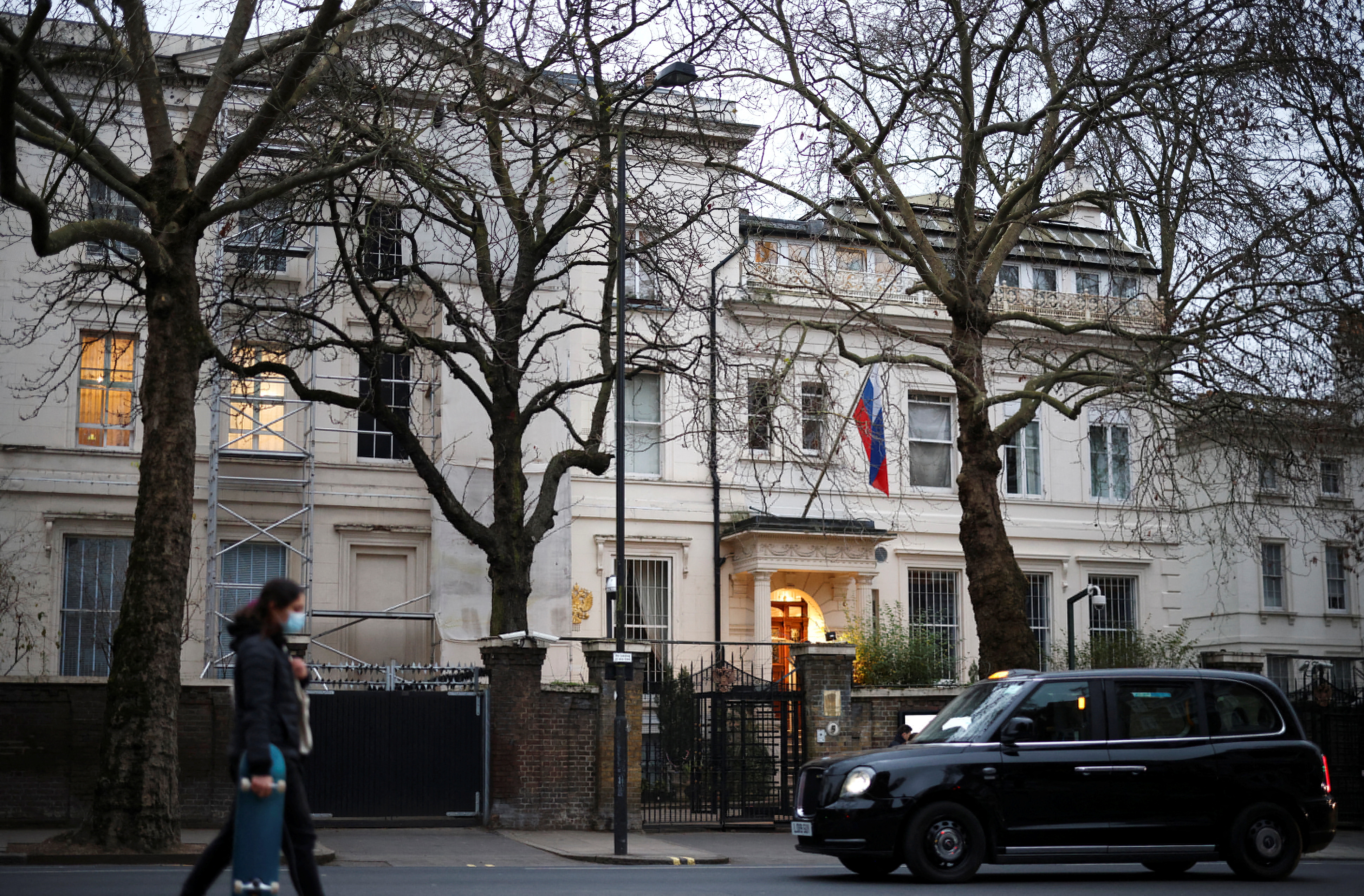 A person walks in front of the Russian embassy in London, Britain, January 23, 2022. REUTERS/Henry Nicholls