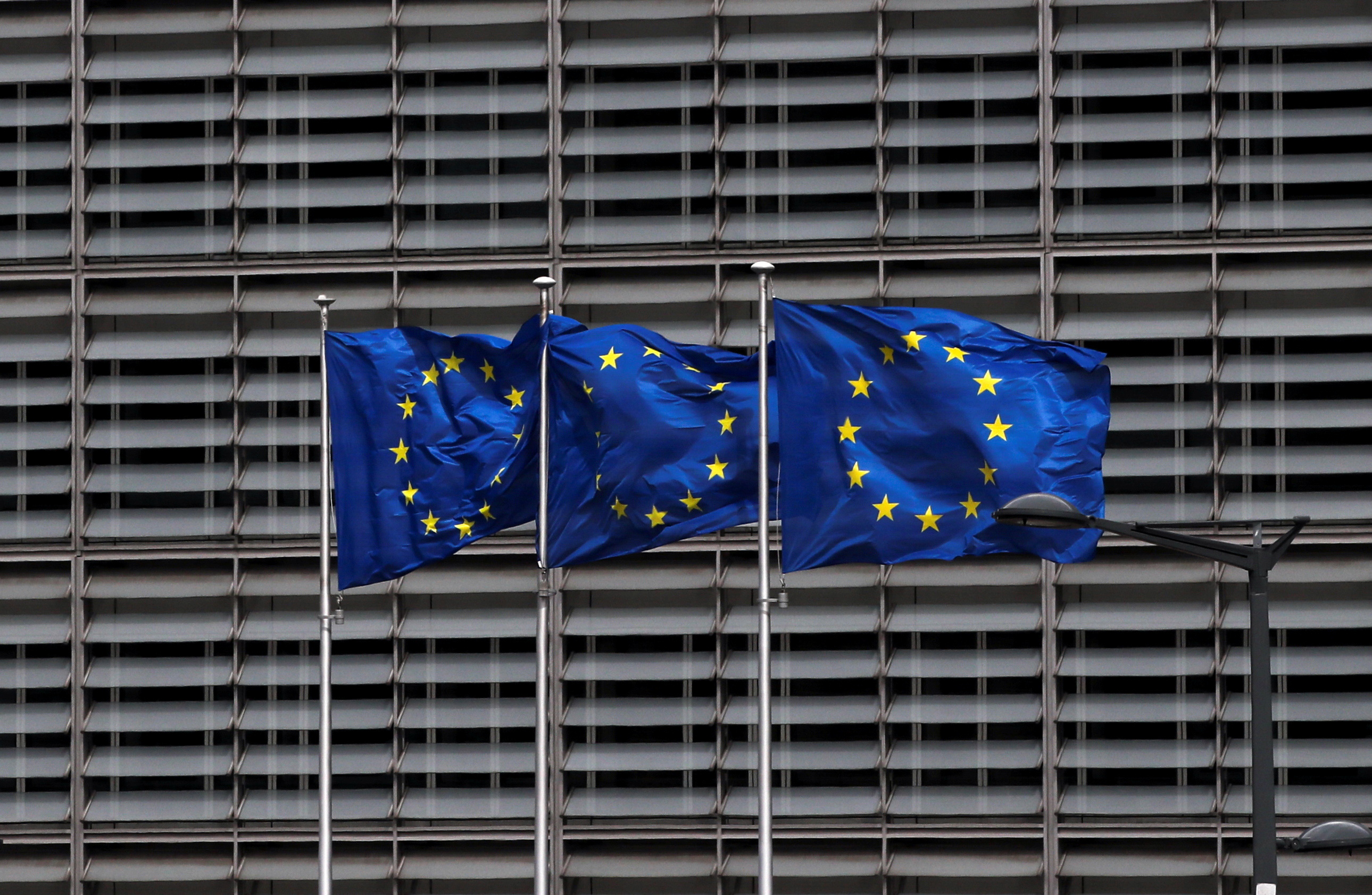 European Union flags flutter outside the EU Commission headquarters in Brussels, Belgium May 5, 2021. REUTERS/Yves Herman