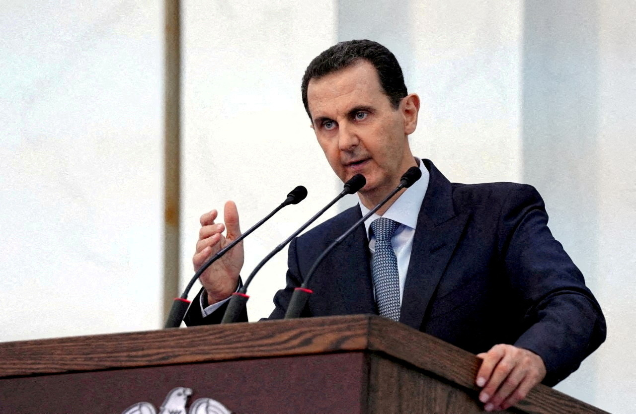 FILE PHOTO: Syrian President Bashar al-Assad addresses the new members of parliament in Damascus