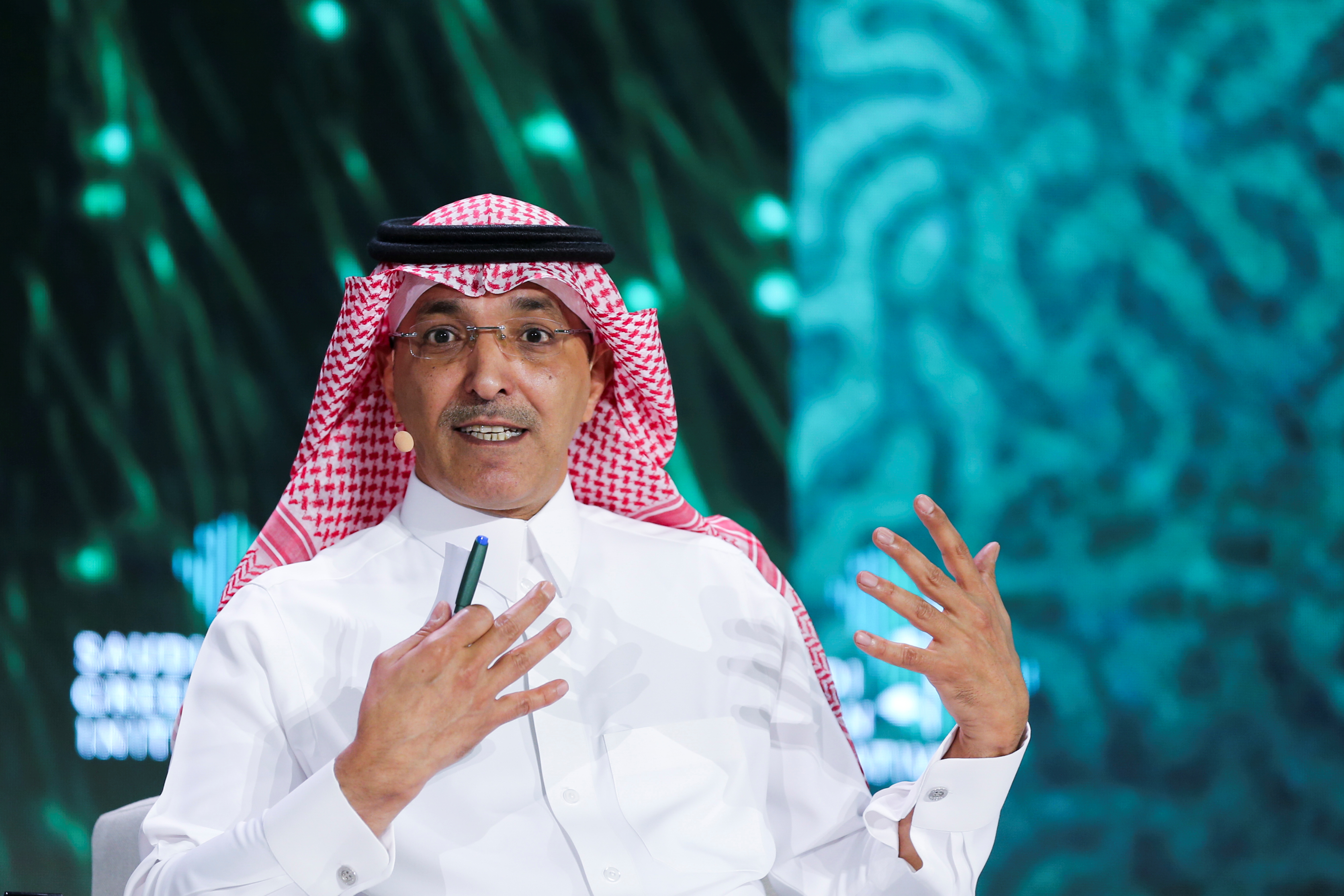 Saudi Minister of Finance Mohammed al-Jadaan gestures as he speaks during the Saudi Green Initiative Forum to discuss efforts by the world's top oil exporter to tackle climate change in Riyadh, Saudi Arabia, October 23, 2021. REUTERS/Ahmed Yosri