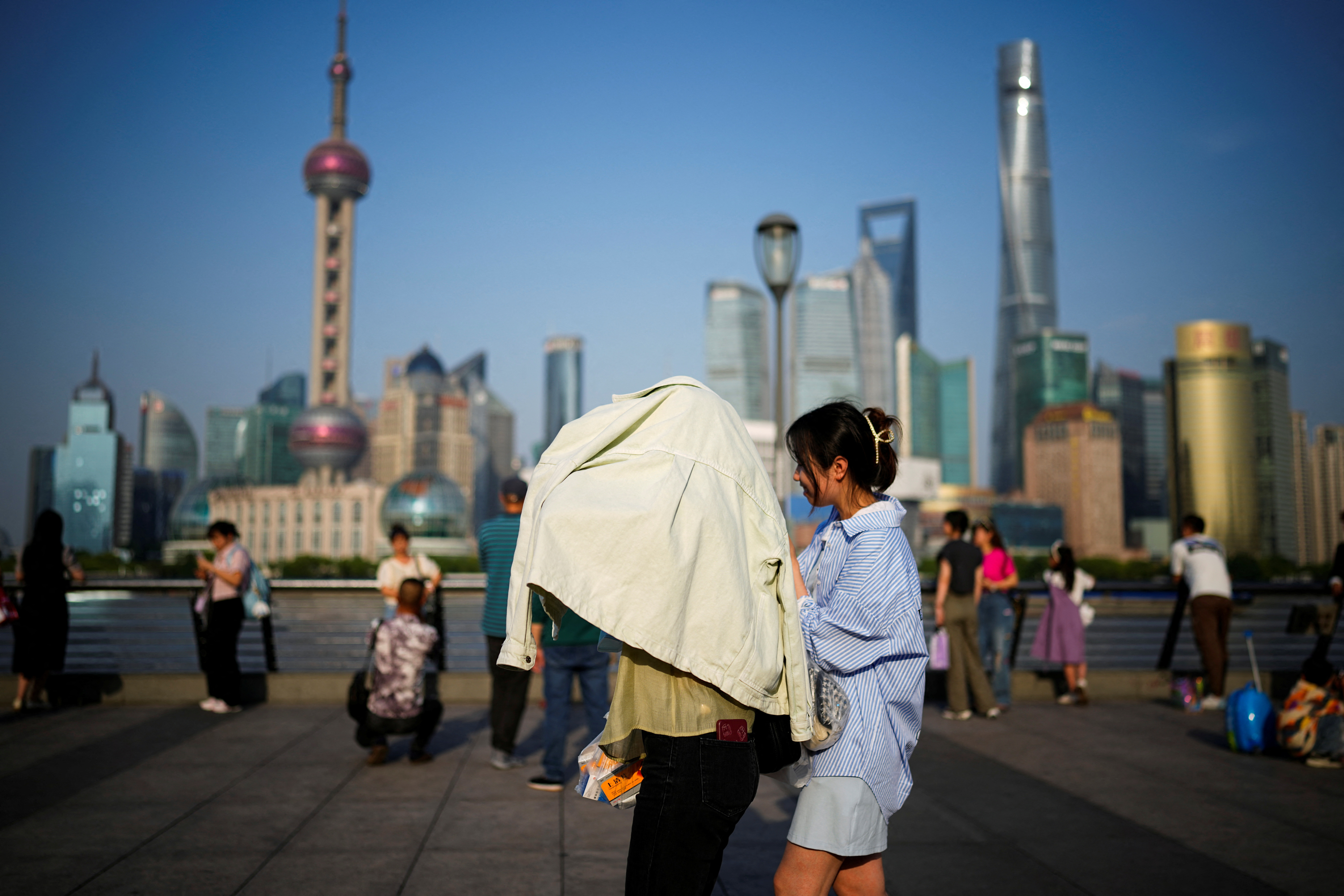 Shanghai breaks more than century-old heat record in sweltering May | Reuters