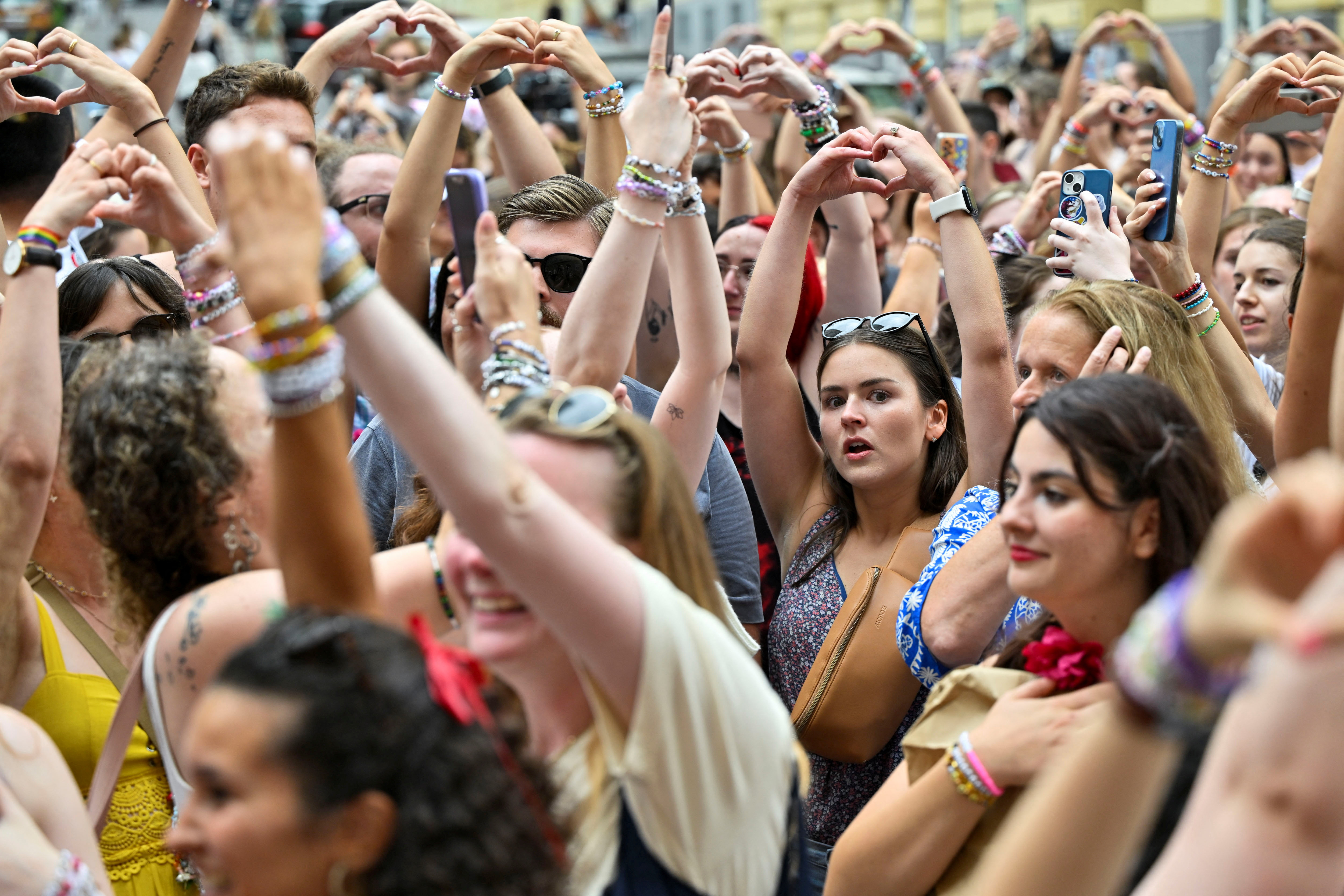 Fans gather after the government confirmed a planned attack at the venue of three Taylor Swift concerts, in Vienna