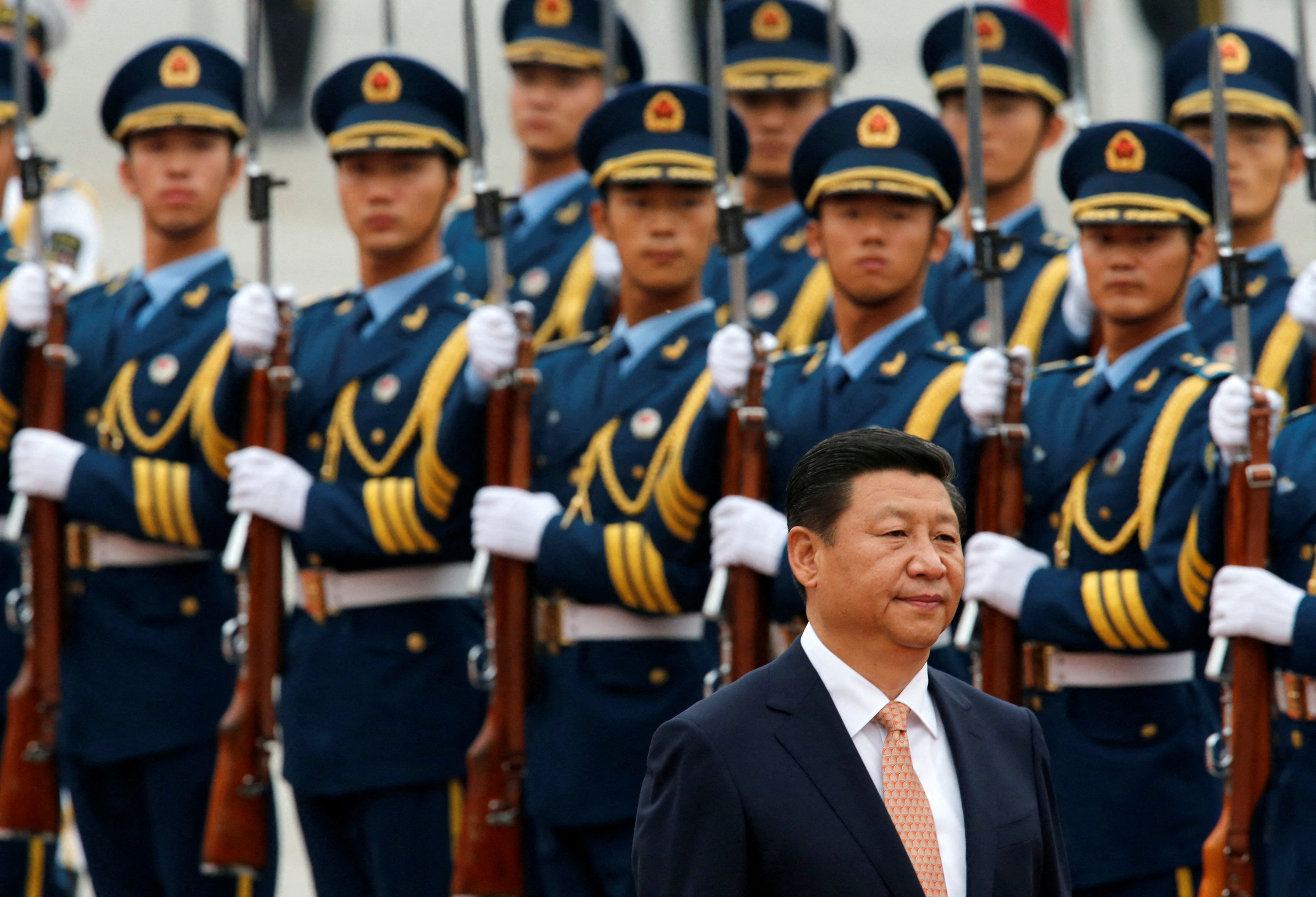 Chinese President Xi Jinping inspects an honour guard with Venezuelan President Nicolas Maduro (not pictured) at a welcoming ceremony outside the Great Hall of the People in Beijing