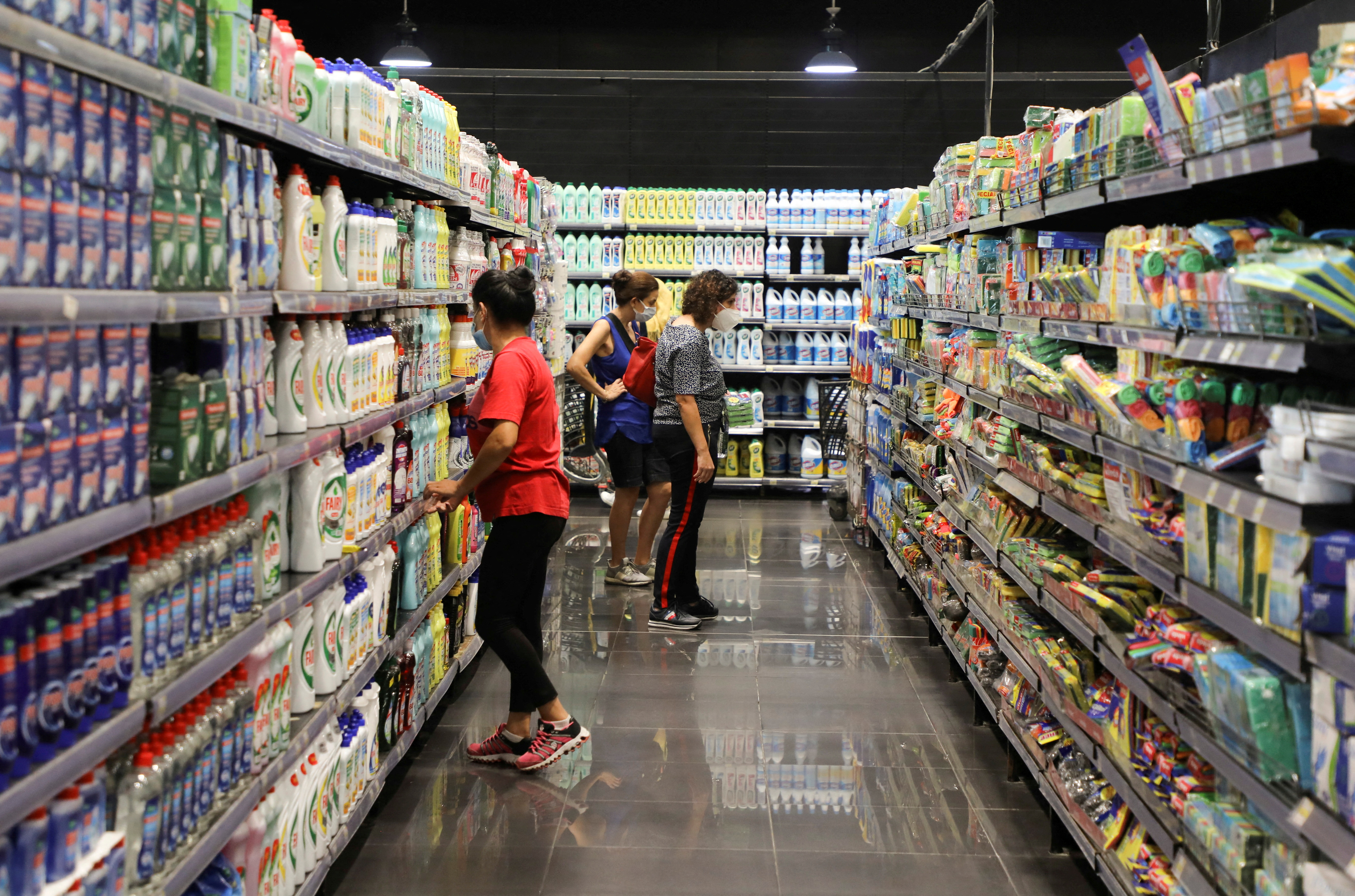 Women check for prices inside a supermarket in Beirut, Lebanon, September 8, 2021. REUTERS/Mohamed Azakir/File Photo