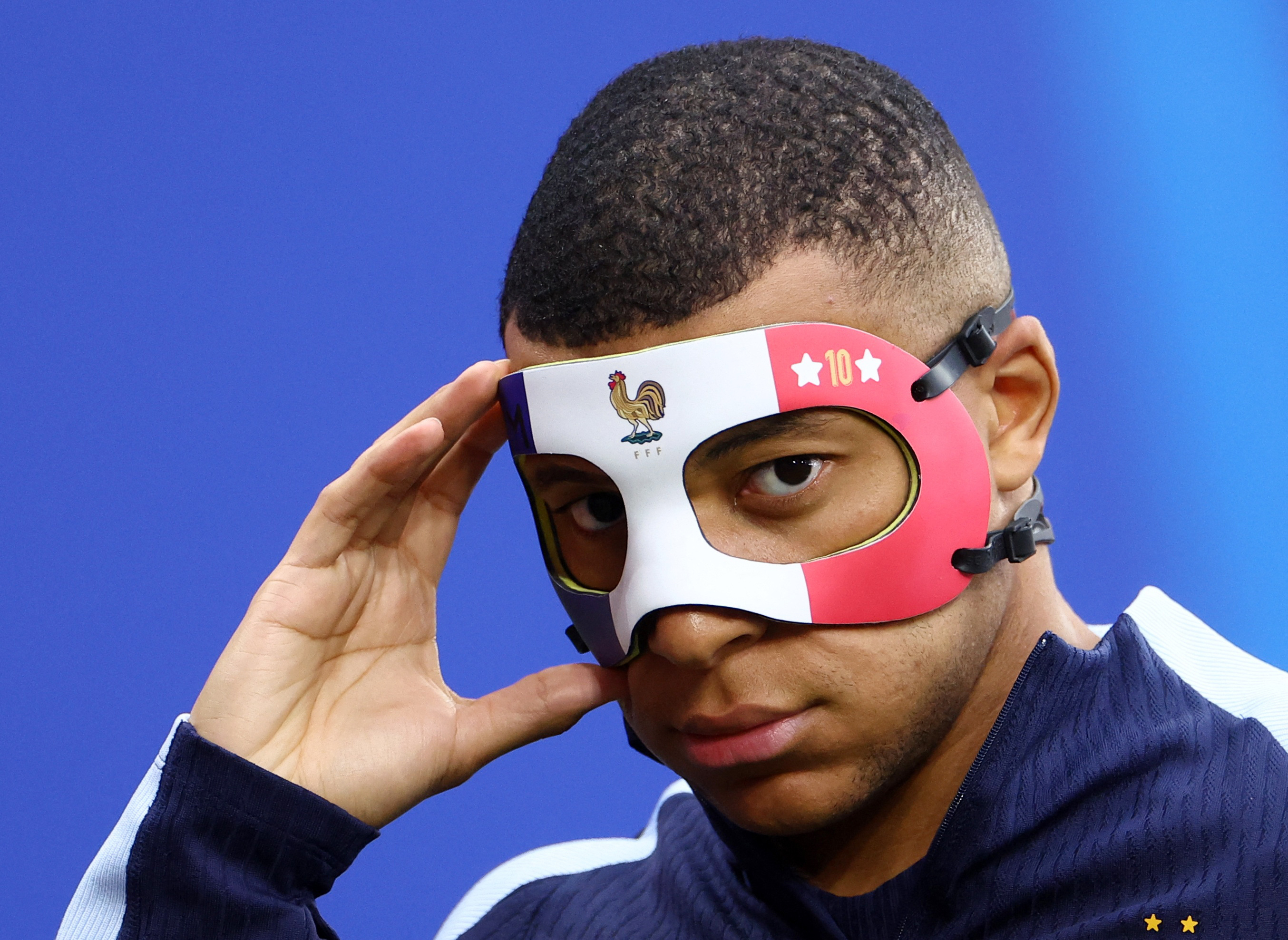 Mbappe fit to face Netherlands - wearing a mask | Reuters