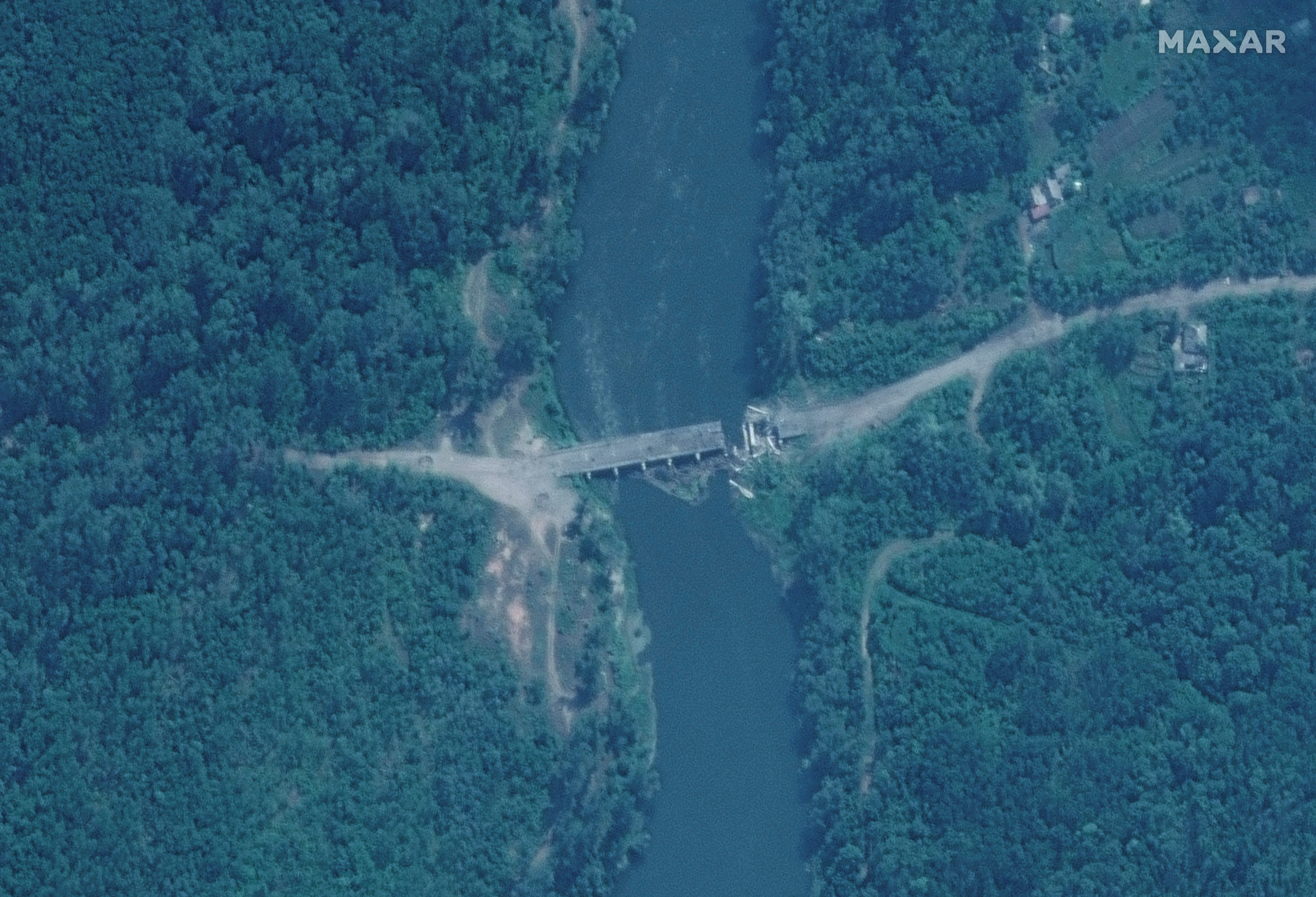 A satellite image shows an overview of a damaged bridge, in Rubizhne