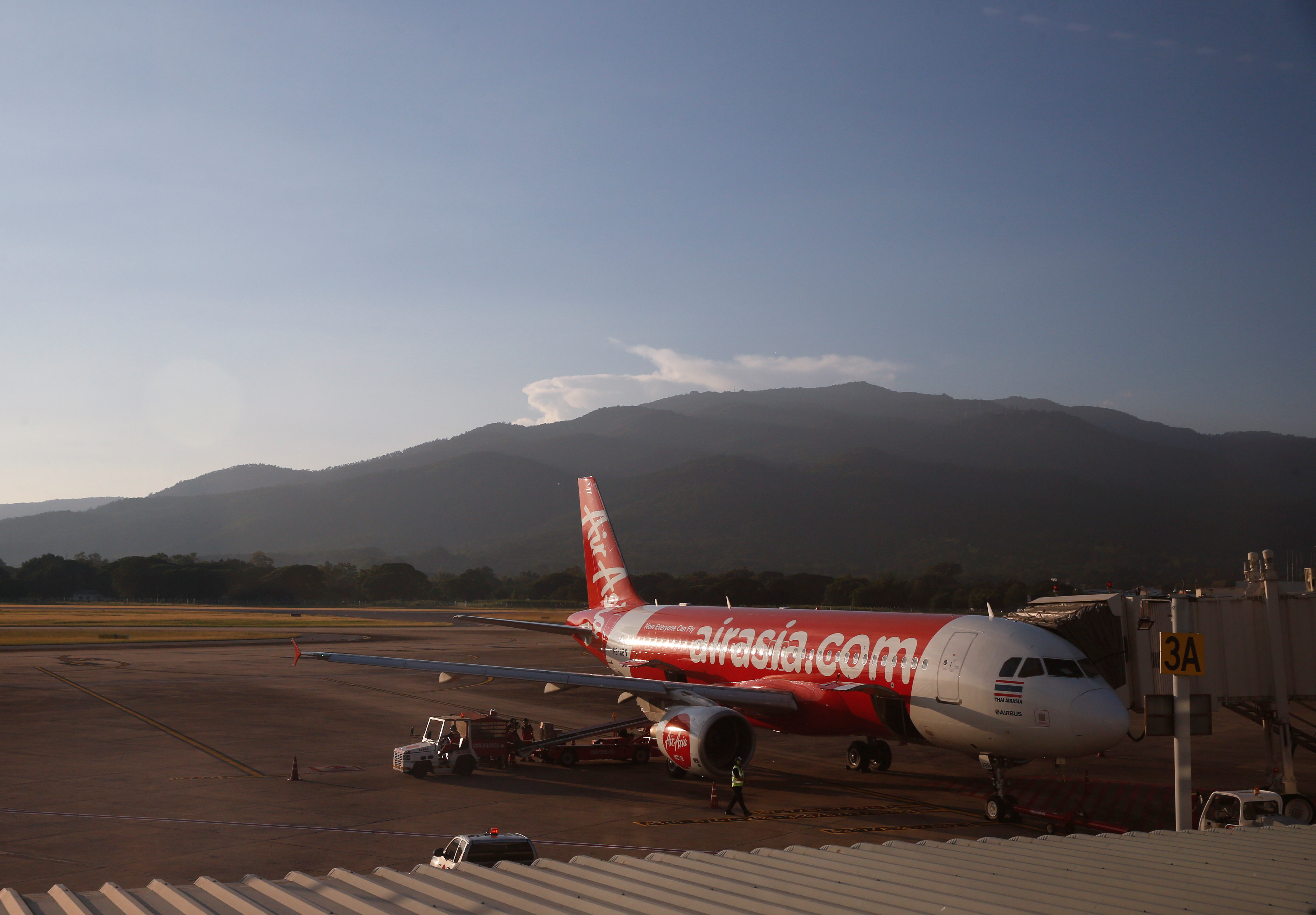 An AirAsia airplane is seen at the airport of popular tourist destination Chiang Mai, as the country reopens its borders to vaccinated tourists in Bangkok, Thailand November 16, 2021. Picture taken on November 16, 2021. REUTERS/Soe Zeya Tun