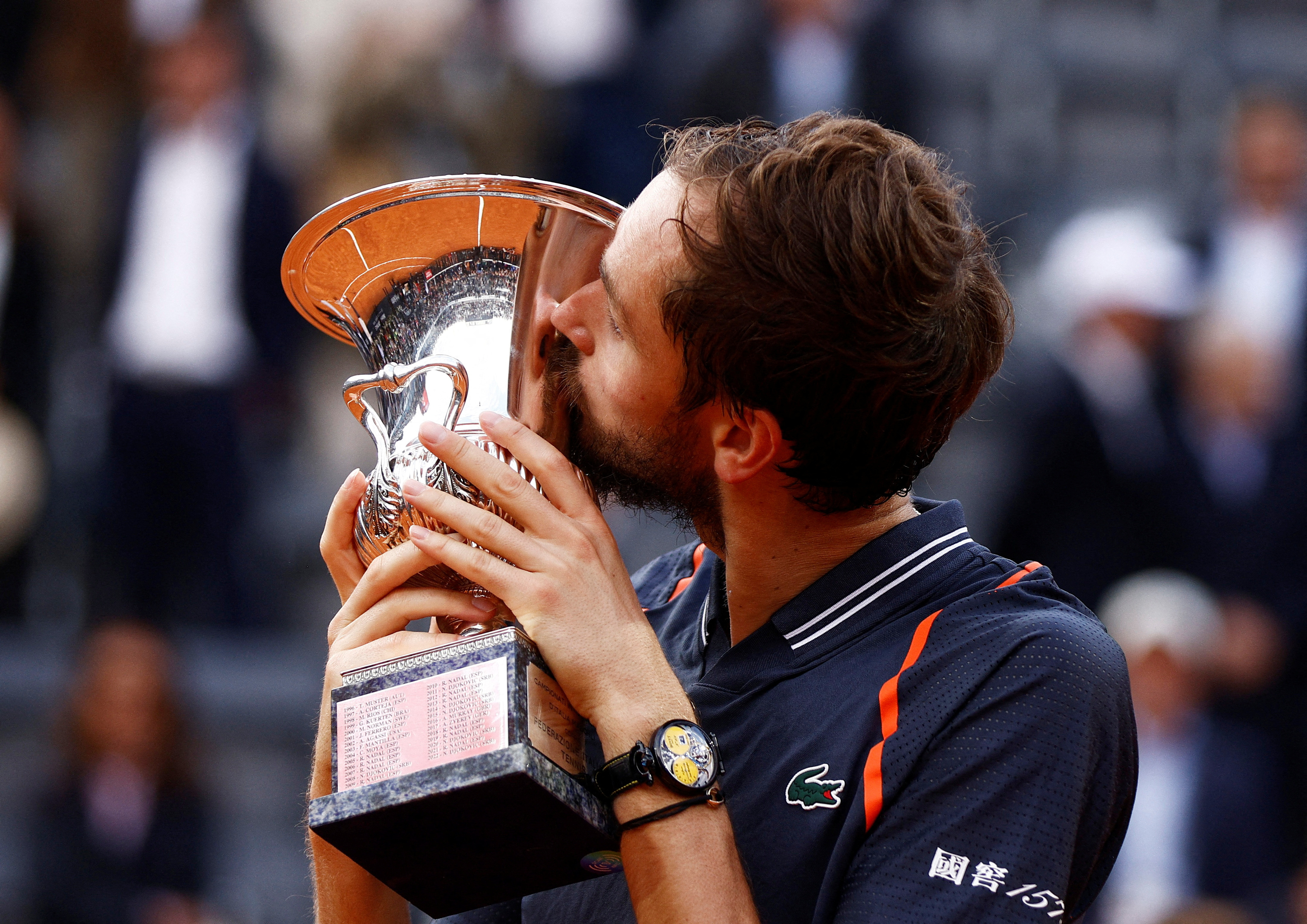 Daniil Medvedev of Russia, right, poses after winning the final