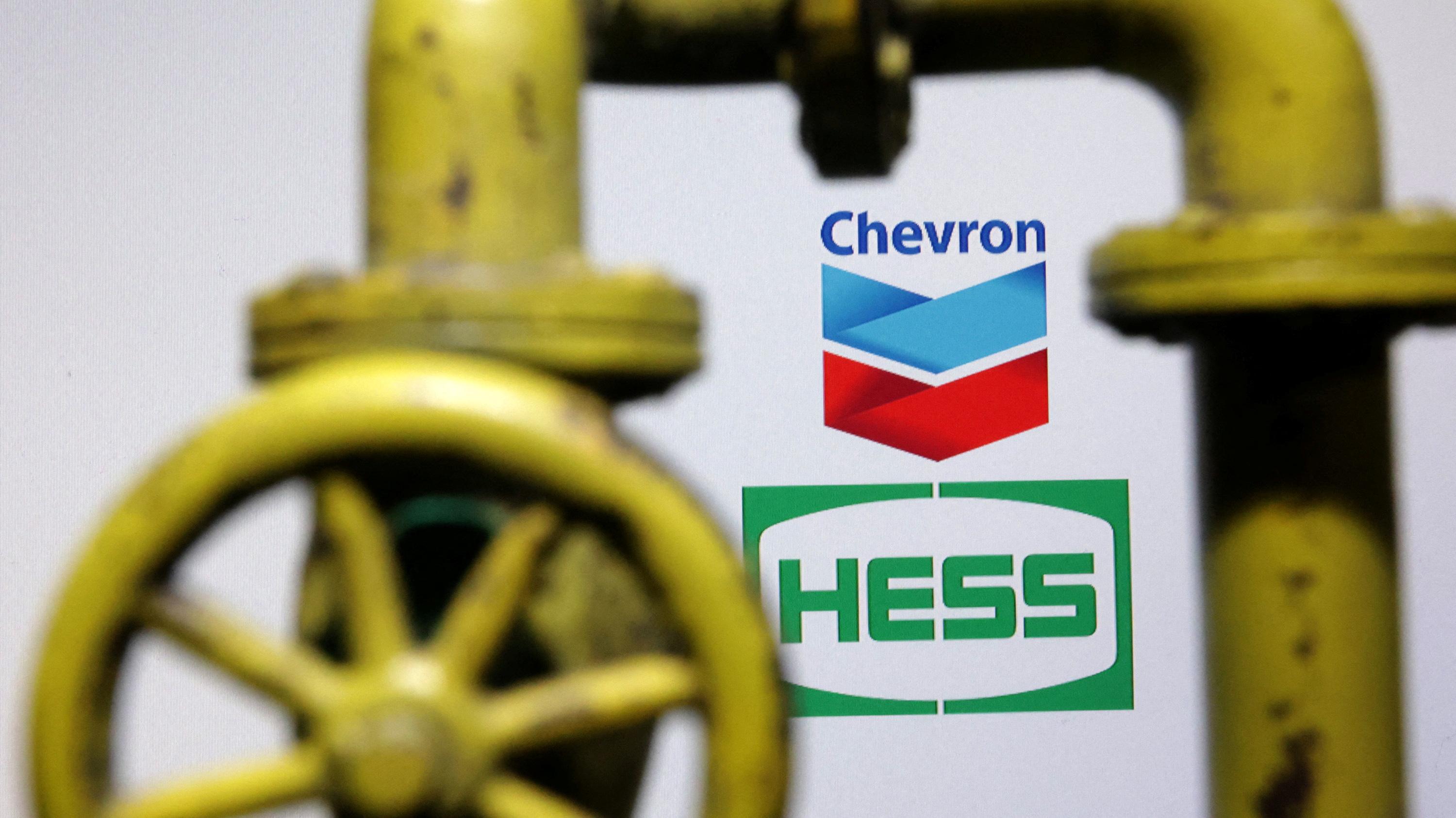 Illustration shows Chevron and Hess logos
