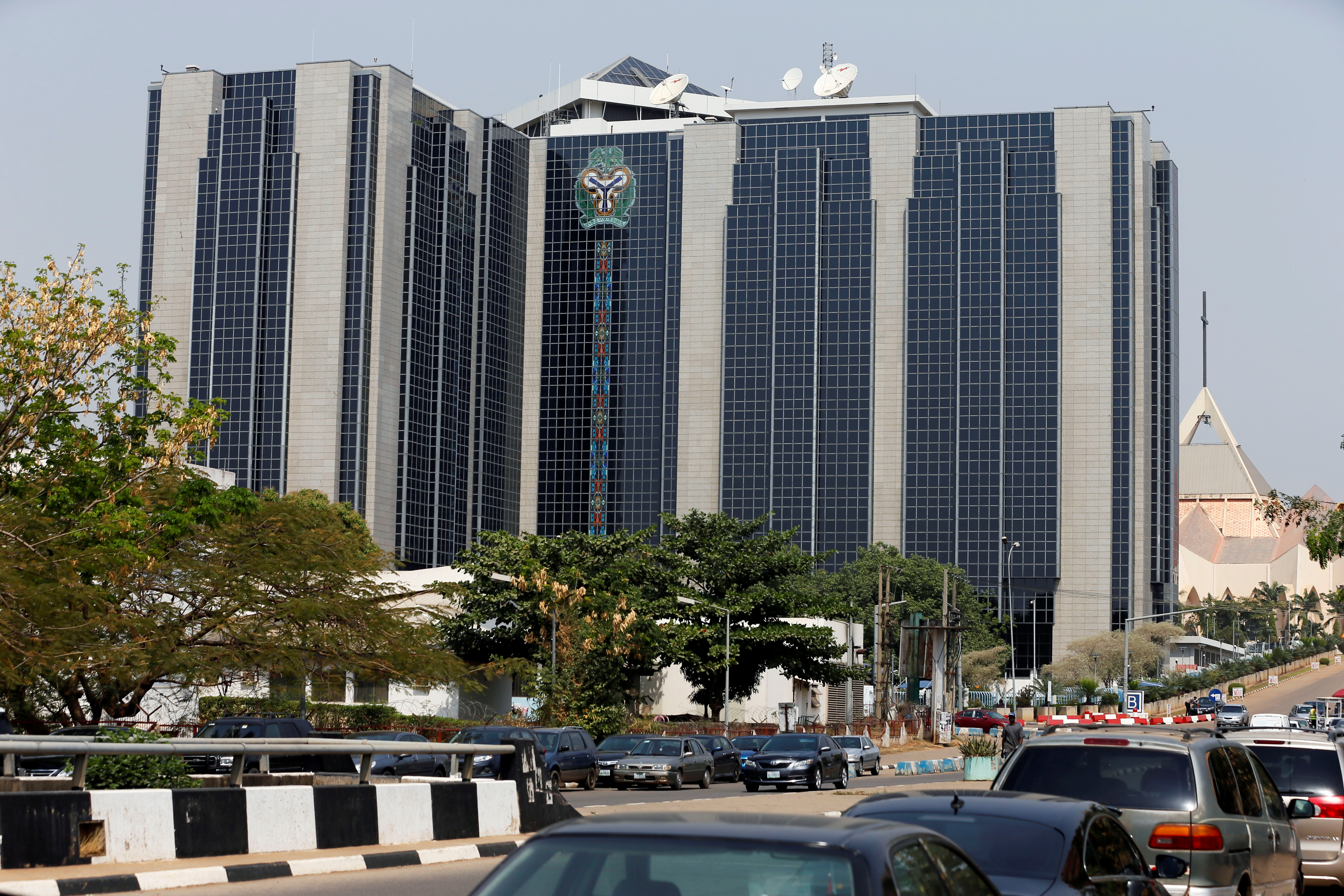 Central Bank of Nigeria's logo is seen on the headquarters building in Abuja