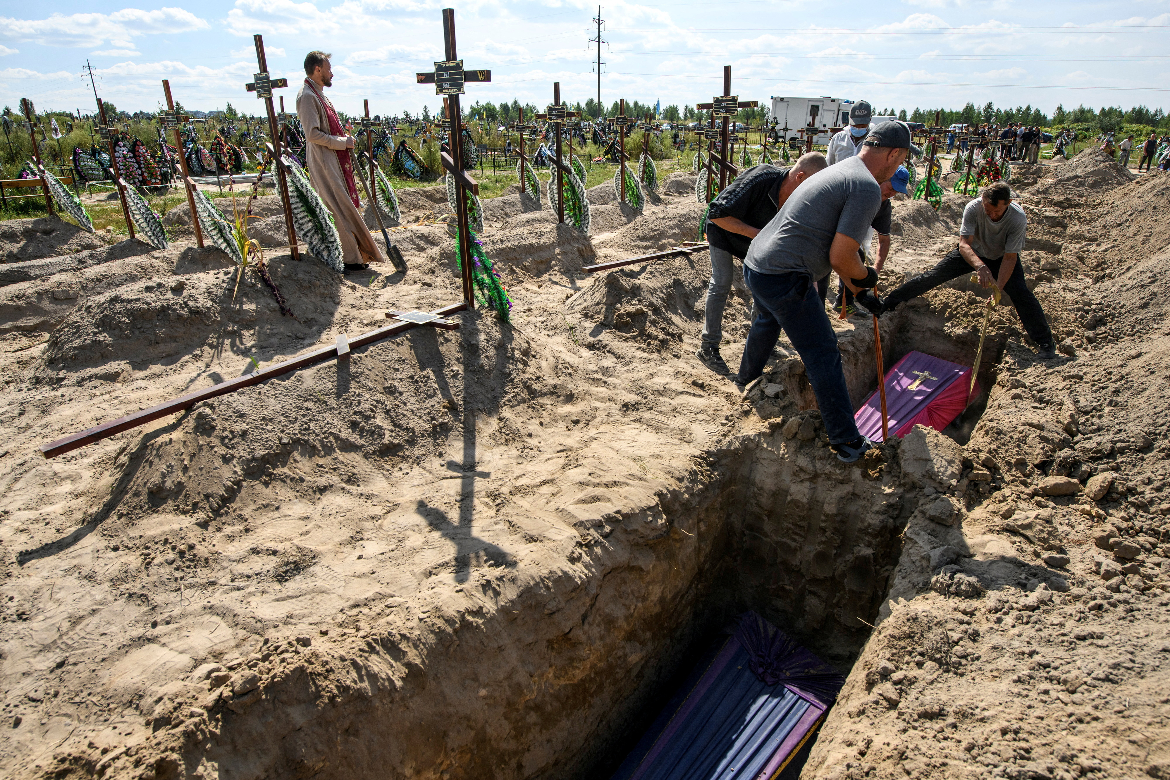 Mass burial of unidentified people killed during Russian invasion in Bucha